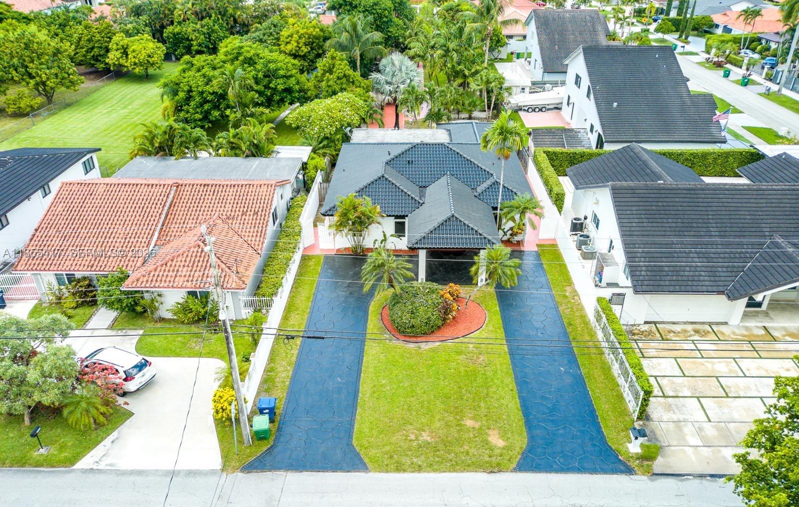 BEAUTIBEAUTIFULL HOUSE FOR SALE IN A GREAT LIVING AREA, this stunning single-family home is the epitome of Location, and much more! 18,300 SQFT lot is a true oasis, featuring a summer kitchen and tiki huts, perfect for enluxury and comfort. Boasting 4 spacious bedrooms and 3 modern bathrooms, this home offers ample space for the whole family. The office provides the perfect space for remote work or study. Tile throughout the home. The expansive 2,732 SQFT. Tax Roll is incorrect. tertaining guests or enjoying a peaceful evening outdoors. The exceptional landscaping adds a touch of serenity to the property, creating a tranquil atmosphere. Located within walking distance to FIU and in a centric location, this home offers convenience and accessibility to all the amenities Miami has to offer.