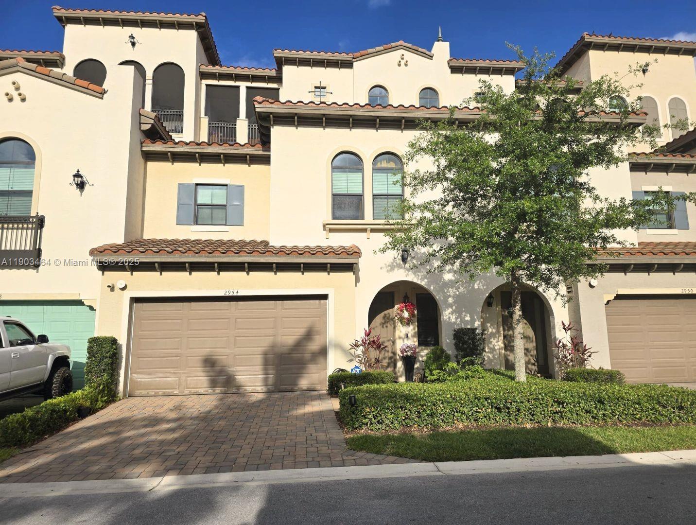 Built in 2019, this stunning 4-story townhome in the guard-gated Artesia community offers space, style, and resort-style living. It features an open-concept first floor, a spacious primary suite on the second floor, a versatile third-floor studio, and a flexible fourth-floor space with access to a screened-in rooftop patio. Enjoy a private backyard patio, ample closet space, and stylish finishes. Artesia amenities include pools, a gym, sports courts, and 24/7 security. Across the road from Sawgrass Mills Mall and the Amerant Bank Arena, with museums, parks, restaurants, and more nearby. It’s a neighborhood where every day feels like a vacation! Don’t miss your chance to live in the heart of it all.