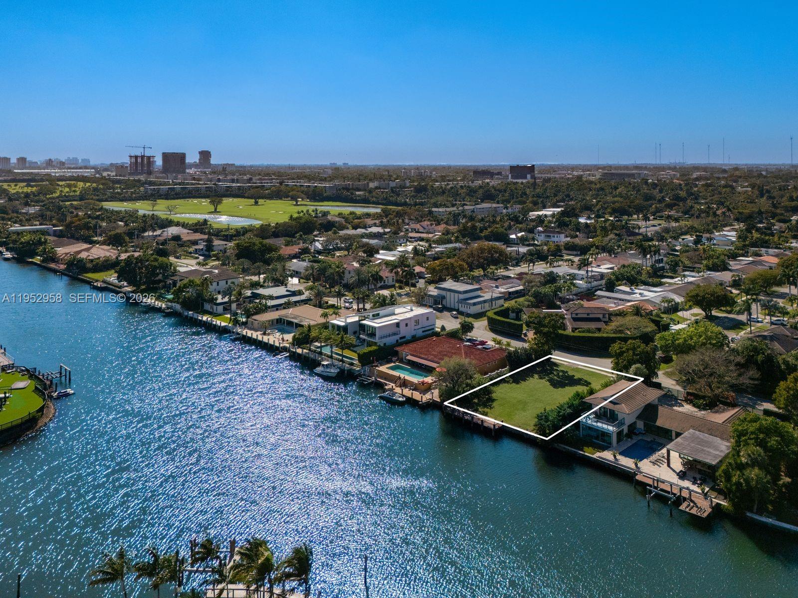 Prime Waterfront Development Opportunity on Diplomat Parkway. Well positioned 11,700 SF waterfront lot featuring 90 ft of deep-water frontage, ocean access, and stunning views to Harbor Islands. Offered with plans for a striking modern waterfront residence meticulously designed by Hugo Mijares / OneDBMiami, envisioned as a sophisticated new construction home maximizing views, indoor-outdoor living, and contemporary coastal luxury. Ideally positioned near the newly developed Shell Bay Auberge Resort Collection Residences & Private Club, offering a Greg Norman championship golf course, private yacht club, wellness spa, and world-class amenities (membership optional). This prime location appeals to boating enthusiasts and buyers seeking privacy, prestige, and convenience in a rapidly evolving luxury enclave. A rare opportunity to build a bespoke waterfront estate and create the ultimate South Florida lifestyle.