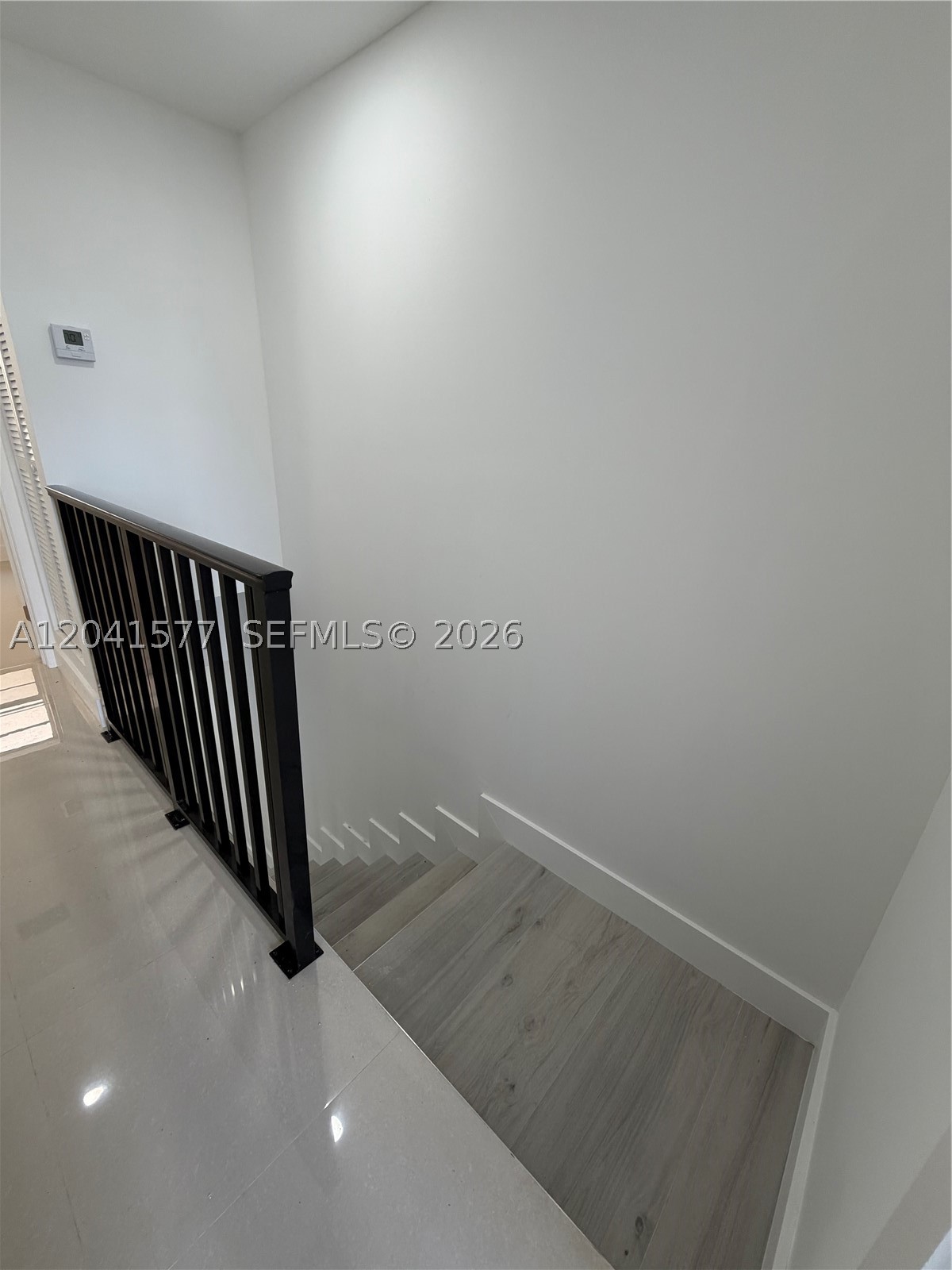 Remodeled apartment townhouse style in a very centrally located area. 2 bedroom plus 1 full bathroom and 1 half bathroom. Commercial washer and dryer in the building. Balcony with sliding door. 2 bedroom and one full bathroom upstairs. The kitchen, living area and half bathroom are located on the first floor of the unit. The full bedrooms and bathroom are on the second floor. Very clean and super bright with natural light. Kitchen cabinets and quartz countertops. Refrigerator, range, microwave included in the kitchen. Central A/C. Tile thorough the entire apartment. This apartment style townhouse has two-level story connected by a staircase. They offer a distinct separation between living and sleeping areas. Enjoy modern conveniences while living in a building with a shopping center nearby.