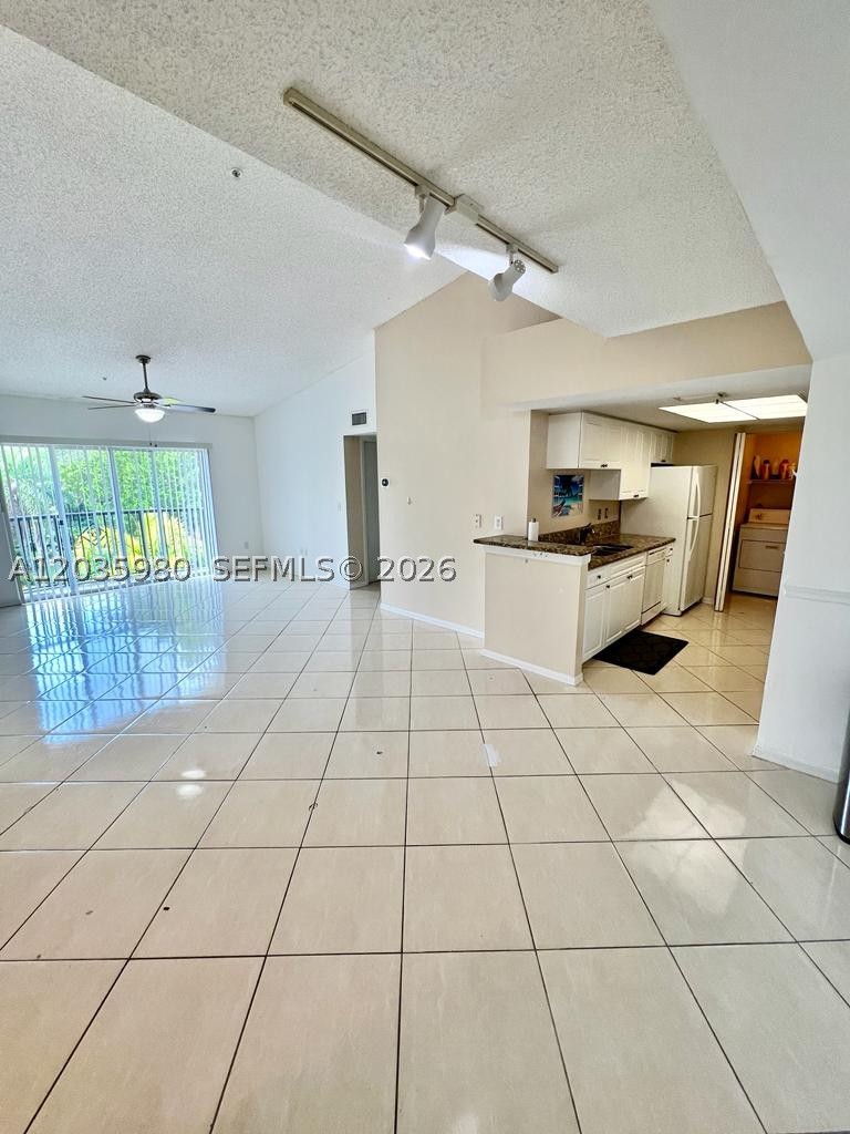 Rare 3 bedroom 2 bath unit located in the Excellently maintained Grand View at Crestwood complex. Third floor unit with vaulted ceilings currently available for immediate move-in. Tiled floors in the rooms, no carpet! Masters has a walk-in closet. The gated community offers resort-type amenities such as two pools, fitness center and tennis courts and two playgrounds on vast open spaces surrounding community, many recent community renovations & improvements completed by association. Centrally located between Southern and Okeechobee Blvd. near Turnpike, Wellington, dining, and shoppes and Palms West Hospital and a Pediatric Only ER. Nest Thermostat and August smart lock to add smart home features. Available now!