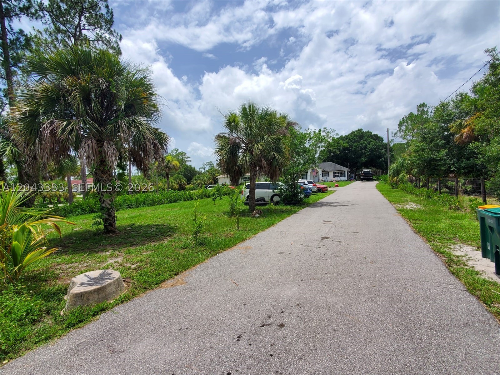 LOCATION LOCATION LOCATION! This beautiful 3-bedroom, 2-bathroom home sits on 1.14 acres in the desirable Golden Gate Estates. The roof was replaced in 2021, providing added value and peace of mind. Located on 4th Ave NE, just off Everglades Blvd N, this property is only a few blocks from a shopping center that includes a Bravo Supermarket, nail salon, barbershop, and other convenient businesses. Directly across the street is a 7 Food Mart, and just minutes away you'll find Tractor Supply, additional grocery stores, pharmacies, gas stations, and more. The location is ideal for families, with the elementary school and middle school both approximately 6 minutes away, and Palmetto Ridge High School only 11 minutes away. This property is zoned E-Estate, allowing horses, livestock, poultry, fowl, hoofed animals, and unlimited cats and dogs. Bring all your farm animals and enjoy peaceful country living while still being close to everything you need. The home features a large asphalt driveway that extends from the gated entrance to the front of the house, including two asphalt parking spaces. The property is enhanced by a variety of young fruit trees, including one mango tree, more than six lime trees, two lemon trees, five sour orange trees, five coconut trees, and more. The lot is mostly cleared, with only a few shade trees providing shelter for animals. It is fully fenced