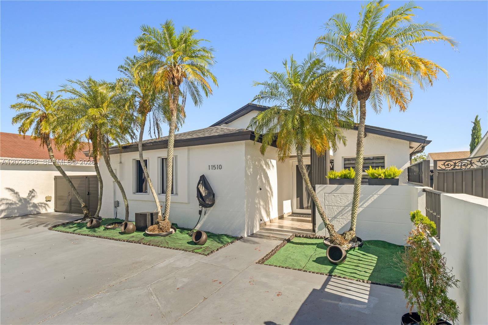 Welcome to this stunning, one-of-a-kind cul-de-sac retreat in South Miami Heights — where luxury upgrades meet South Florida outdoor living at its finest.

Step inside to an open-concept living area filled with natural light, flowing seamlessly into a functional layout designed for modern living. Two completely remodeled spa-inspired bathrooms feature floor-to-ceiling Calacatta marble, smart LED bidet toilets, rain shower systems, frameless glass enclosures, and backlit smart mirrors. A versatile flex space offers the perfect additional room — ideal as a 4th bedroom, home office, or den.

The kitchen features stainless steel appliances only 2 years old. Outside: a fully enclosed outdoor kitchen with granite counters and gas grill, covered patio with retractable awning, and a premium above-ground Jacuzzi whirlpool — all included.

Brand new roof, high-impact glass windows and doors (shutters on 2 windows), custom frosted glass barn doors, and a modern exterior with sleek black slat accent panels. Spacious yard offers room for a pool or future expansion.

Minutes from the Florida Turnpike, zoned for quality nearby schools, and priced to sell — this one will not last!