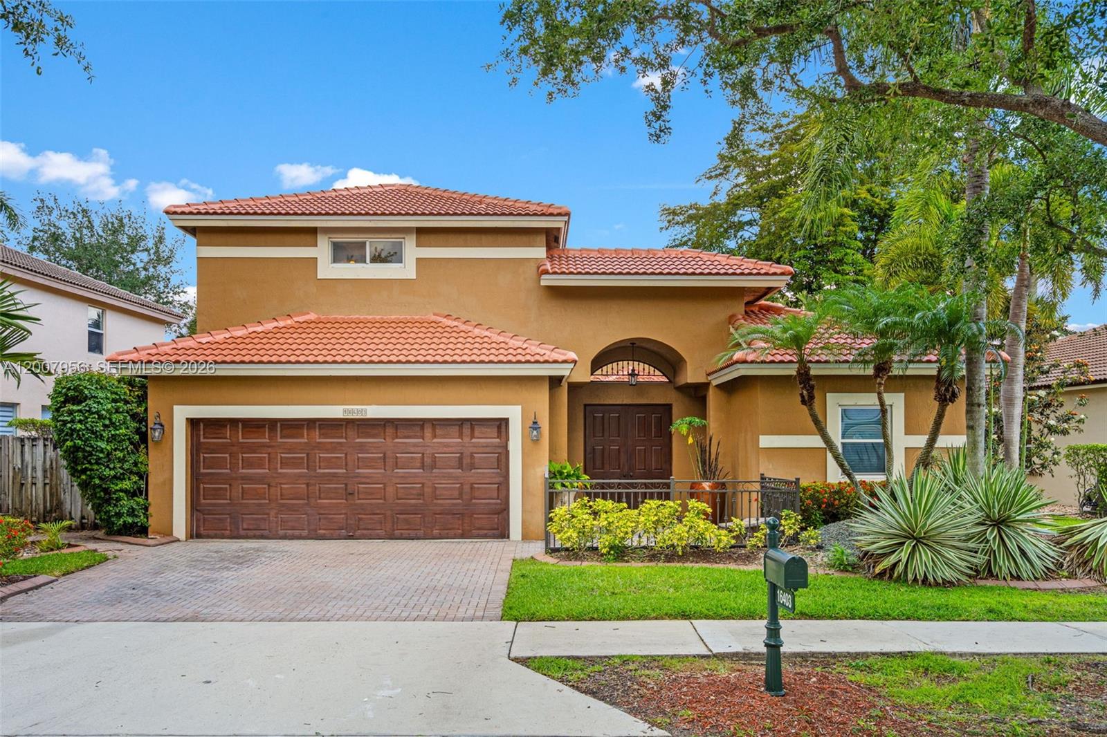 Stunning courtyard pool home in the gated community of Emerald Estates, featuring 4 bedrooms, 4 bathrooms, and a desirable private guest house. Designed for both comfort and entertaining, the guest house overlooks the pool, creating a unique and inviting indoor-outdoor living experience. The home showcases quality upgrades   throughout, including impact windows, laminate flooring, custom paint, crown molding, and architectural niches. The renovated kitchen features shaker-style cabinetry, granite countertops, stainless steel appliances, and a custom hood. Bathrooms have been thoughtfully updated with modern finishes. The impressive living room boasts a dramatic 20-foot ceiling and elegant iron staircase. Upstairs, a loft connects two bedrooms with a Jack-and-Jill bath. The spacious primary suite offers a sitting area, custom walk-in closet, and a spa-like bathroom with soaking tub, separate shower, and dual vanities.  Enjoy outdoor living with lush tropical landscaping, landscape lighting, a pergola, paver patio and walkways, heated pool, spa, and a fully fenced yard.