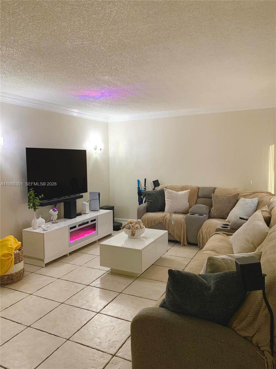 One of the largest units in the community! Spacious two-story corner unit that features more privacy, 3 bedrooms, 2.5 bath, separate laundry room, living room, family room, and fenced/gated backyard with synthetic turf and paved floors! Updated kitchen cabinets and beautiful bathroom vanities with quartz countertops, tiles on lower floor, laminate flooring upstairs, plenty of storage space and closets in the main bedroom. New faucets and motion sensor kitchen faucet. Impact windows in the front. Community has tennis court, swimming pool, basketball court and clubhouse. Basic cable is included.