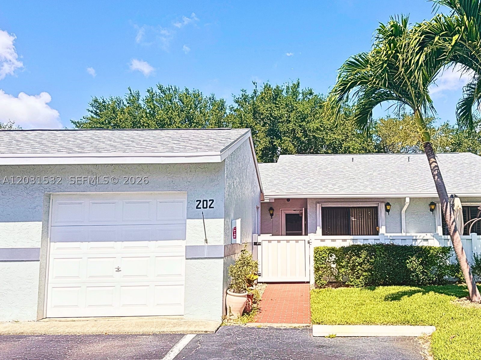 Welcome to this immaculate 2-bedroom, 2-bath villa in the highly desirable 55+ community of The Arbours II. Thoughtfully maintained and truly move-in ready, this home offers a rare combination of major upgrades, low-maintenance living, and exceptional value.

Enjoy complete peace of mind with a brand-new roof installed in 2025, hurricane impact windows, and storm shutters, providing both protection and potential insurance savings. Inside, you'll find a spacious split-bedroom floor plan with ceramic tile flooring throughout, creating a bright, clean, and easy-to-maintain living space. The kitchen features a new refrigerator and opens to a private front courtyard patio, perfect for morning coffee or outdoor dining.

The expansive living and dining areas flow seamlessly to a large private patio overlooking a lush green space framed by mature landscaping and a beautiful shade tree. Whether entertaining guests or simply relaxing, this outdoor retreat offers the ideal Florida lifestyle.

The value continues with an HOA that includes cable, high-speed internet, and lawn care, allowing you to enjoy truly carefree living. Conveniently located near the Jog Road and Lake Worth Road corridors, you're just minutes from shopping, dining, golf, beaches, Palm Beach International Airport, and major highways.

If you're searching for a well-maintained home with major updates already completed, low monthly upkeep, and an unbeatable location, this is the one you've been waiting for.