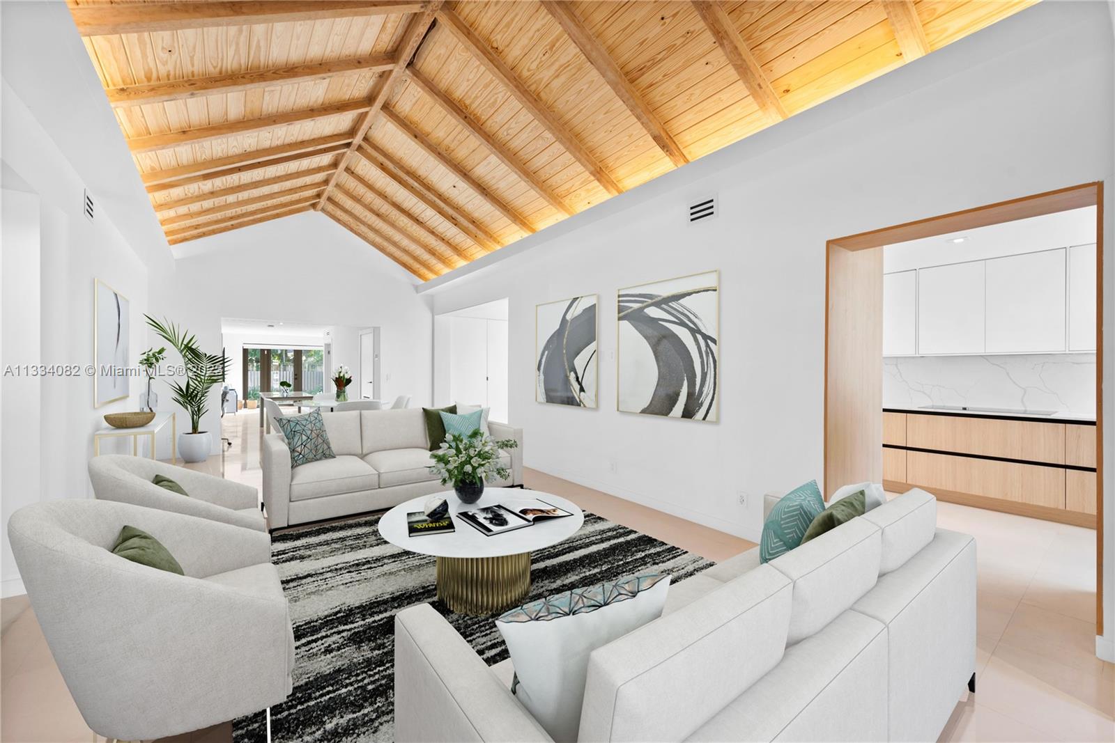 Chic fully remodeled residence in hip & happening Buena Vista! Moments away from the Design District! Easy living all on one floor! This spacious 4BD/3BA home was fully gut renovated, doubled in size & meticulously designed by award-winning high end interior designer, Carmen LandaetaDesign Studio. Boasting spacious sun-filled bedrooms, impact windows, gleaming wood & limestone floors, gorgeous white kitchen w/ breakfast bar & top-of-the-line appliances, stunning Great Room w/ high 12ft ceilings in natural wood, custom built closets, & primary suite w/ spacious walk-in closet & dual sinks. Enjoy a sunroom, formal dining, separate office area & brand new full sized washer/dryer! The serene backyard is fully fenced, private & has ample room for a pool! NO FLOOD INSURANCE!