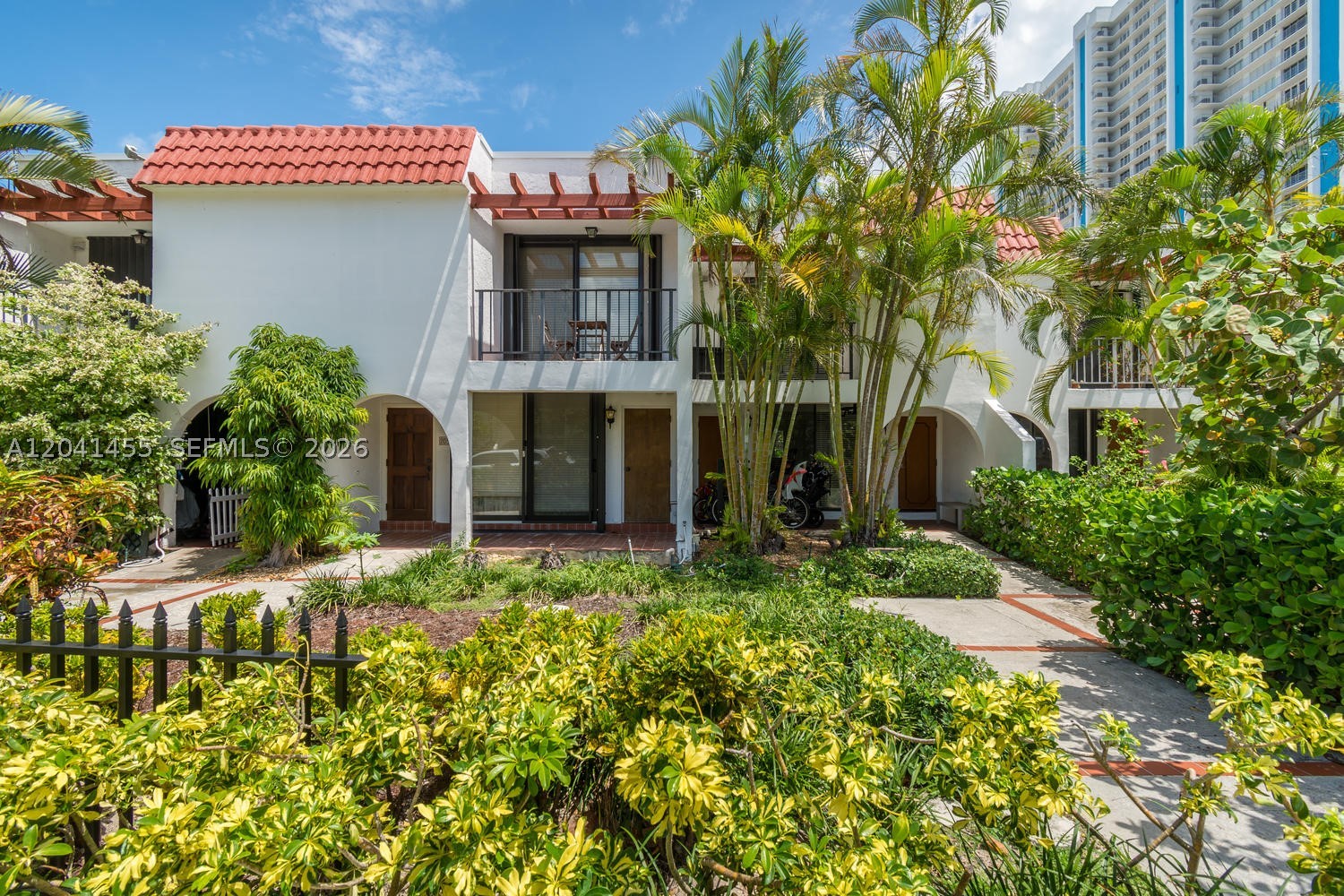 Beautifully remodeled modern townhouse just steps from the beach! This move-in-ready home features the largest patio among the three floor plans, complete with a BBQ area, plus a City-permitted expansion that adds valuable living space. The open-concept layout offers a spacious living and dining area, a renovated kitchen with granite countertops and stainless steel appliances, and two generously sized bedrooms with two full bathrooms upstairs. The primary suite features a private balcony.