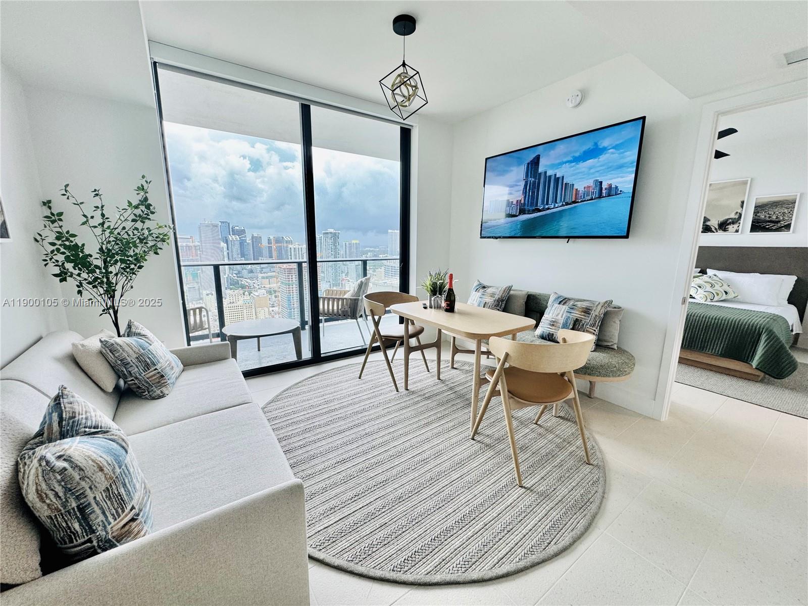 A beautifully furnished 1-bedroom residence featuring expansive city and bay views from the 43rd floor. This stylish home combines modern luxury and convenience. The open layout offers a light-filled living space with floor-to-ceiling glass, European kitchen cabinetry, quartz countertops, and premium appliances. Balcony with a serene escape with panoramic skyline and water views—ideal for morning espresso or evening sunsets. Miami’s most dynamic towers, residents enjoy access to resort-style amenities including an infinity pool, spa, rooftop lounge, state-of-the-art fitness center, coworking and social spaces, and 24-hour security and valet. Steps away from Miami Worldcenter, Brightline Station, Kaseya Center, and Brickell nightlife.