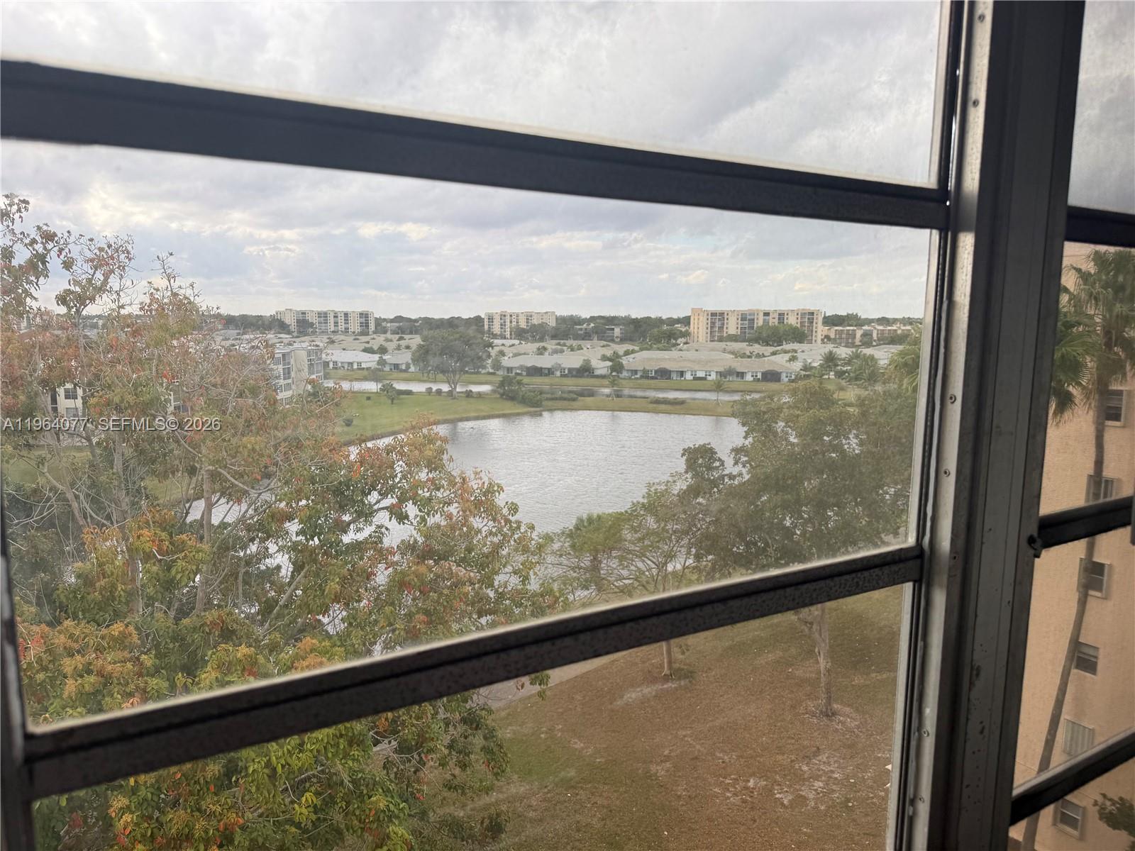 Vacant and easy to show! Priced to sell! Gorgeous lakefront views in the heart of Delray beach.

Welcome to 55+ Bonaire Village!  This 2 bed, 2 bath condo offers a water view with a fountain from your sunroom; perfect for relaxation and comfort (sunroom can be used as a 3rd bedroom using the sofa bed). The open floor provides an inviting space for entertaining or unwinding. Its perfect for anyone who simply wants to move in without the cost and hassle of buying beautiful furniture and furnishings (comes completely equipped!). Features include an eat-in kitchen with granite countertops, a tiled backsplash, lots of natural light, tile throughout, a walk-in shower, a storage locker and a very short walk to the elevator. Washer/Dryer in the kitchen, newer appliances.
Parking spot is located next to the unit. Can be sold furnished.