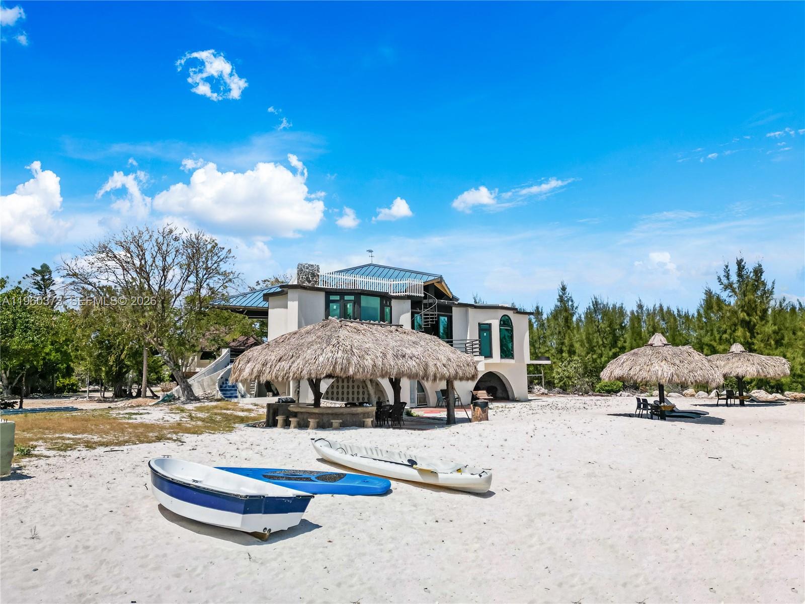 Welcome to The Barnacle Bed and Breakfast, a rare oceanfront offering in Big Pine Key where island living meets income opportunity. This beautifully updated waterfront property allows you to live the Florida Keys lifestyle while hosting it or operate a turnkey hospitality investment in one of the most sought-after settings in the Lower Keys.
The property has undergone an extensive renovation over the past two years and is now updated, featuring a new roof, new windows, remodeled interiors, and upgraded throughout. Offered fully furnished, the estate includes multiple structures with indoor and outdoor kitchens, central water, and electric service, allowing for immediate enjoyment and operation.
Enjoy approximately 150 feet of direct oceanfront on the main parcel, complemented by additional parcels offering flexibility and long-term potential. Boating enthusiasts will appreciate the private beach, bay and ocean access, CBS dockage, private boat ramp, and on-site boat docking, making life on the water effortless.
Currently operating as a bed and breakfast with strong daily rental performance, the property is now fully operational at capacity, presenting immediate income potential. Whether envisioned as a private waterfront retreat, an owner-operated B&B, or an investment opportunity, this is a truly unique chance to own a piece of paradise in the Florida Keys.