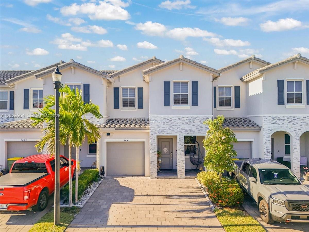 Beautiful 2021 townhome located in the highly desirable gated Riviera community in Homestead! This spacious residence is one of the largest models in the community, offering over 1,800 sq. ft. of comfortable living space with 4 bedrooms and 2.5 bathrooms. The home features a modern open layout, stainless steel appliances, a one-car garage, and a covered patio with pergola—perfect for entertaining and family gatherings. Enjoy resort-style amenities including a clubhouse, pool, and fitness center. Conveniently located just minutes from the Florida Turnpike, shopping, dining, parks, and the Florida Keys. Nearby schools include Somerset Preparatory Academy Homestead, Keys Gate Charter School, and Keys Gate Charter High School. A perfect blend of space, comfort, and convenience in one of Homestead’s fastest-growing areas!