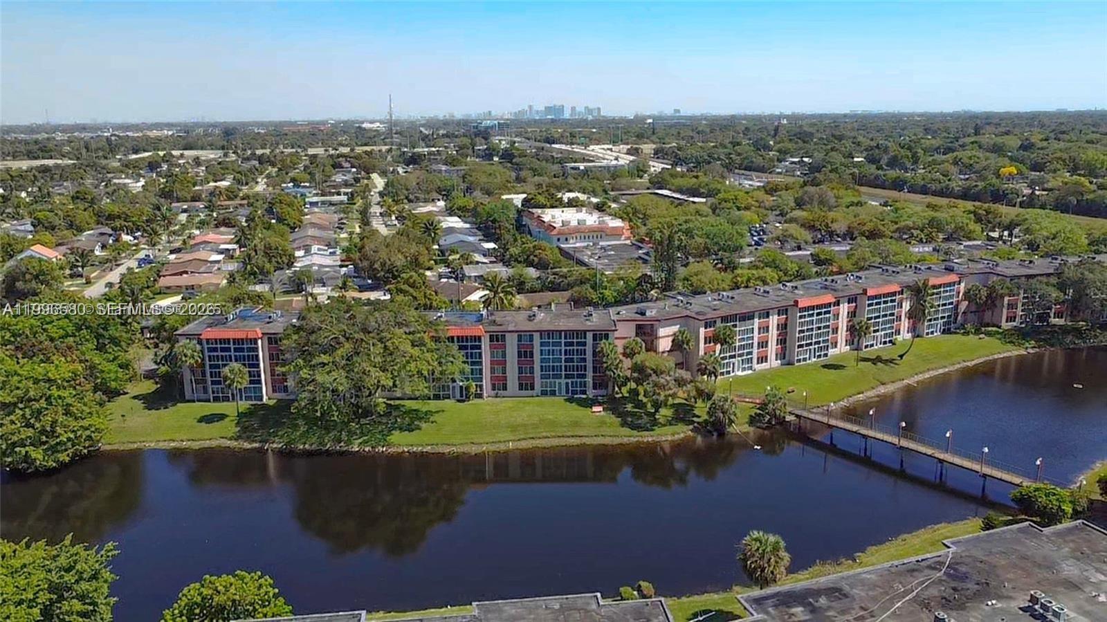 Unique layout turnkey 1bedroom 1.5 bath 55+AFFORDABLE Sunrise Condo ready for your lakefront relaxation. Low maintenance of $452. Renovate to your tastes while making use of substantial well kept furniture as you modernize.  Lovely tranquil setting with softly chirping birds at the lake/canal front overlooking walking bridge to the amenity complex on the other side. 1st floor location is like on a cruise. Mutual privacy as you share the split bath layout with a guest. Multicultural residents make this a great place to call home or visit at your convenience. Near airports, dine, shop, worship. Easy to show.