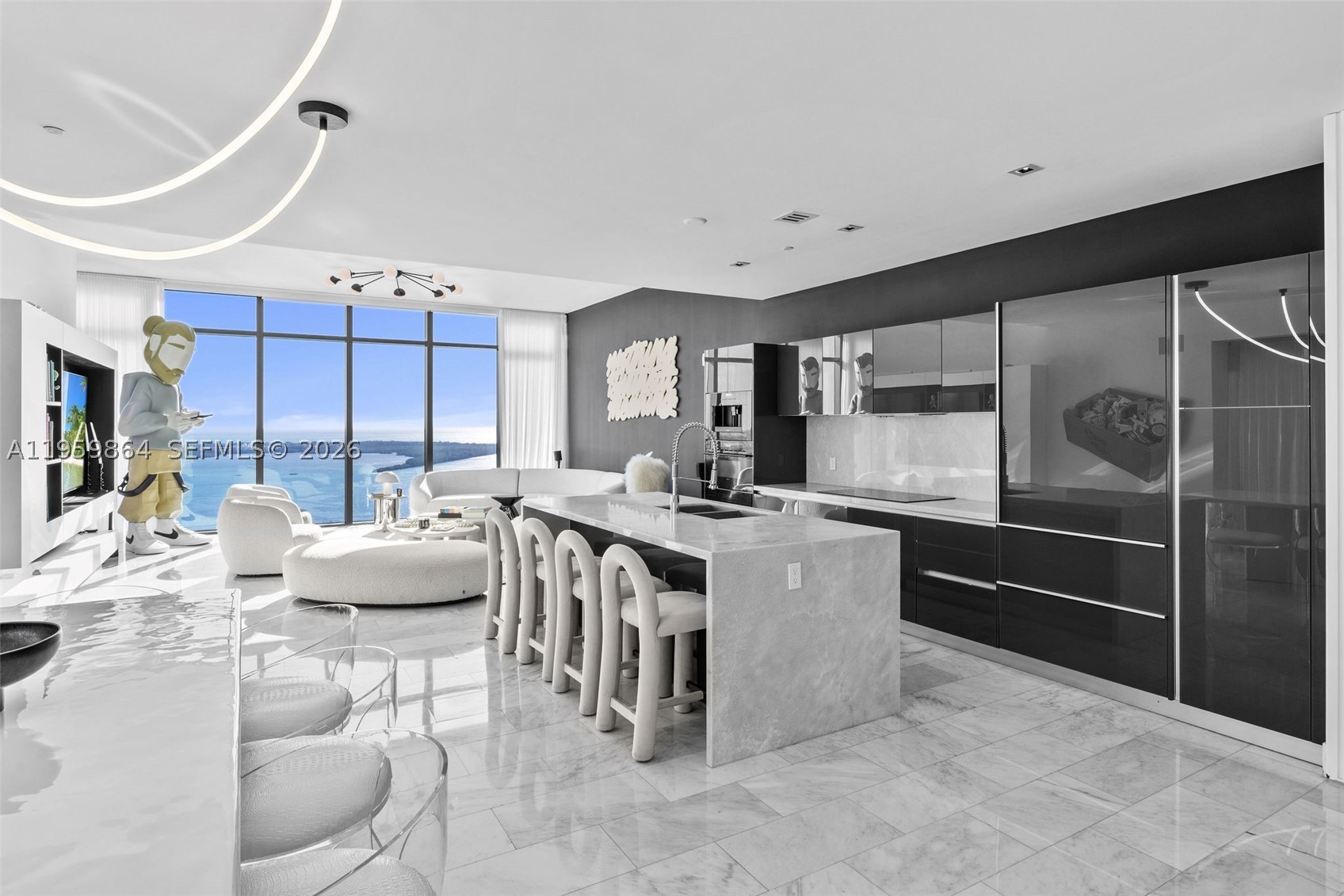High above Brickell on the 44th floor of Echo, this exceptional corner residence captures sweeping 180-degree views of Biscayne Bay, the Brickell skyline, and the Miami Beach horizon. Floor-to-ceiling windows and soaring 12-foot ceilings flood the home with natural light, while refined marble floors and marble kitchen countertops create a seamless, sophisticated aesthetic throughout, complemented by generous gallery-style wall space ideal for displaying art.

The thoughtfully designed kitchen is outfitted with premium Sub-Zero and Wolf appliances. Thoughtful upgrades include a Lutron lighting system, Apple Home technology, living room surround sound, keyless entry, motorized blinds and shades, and beautifully built-out closets for effortless living.

Enjoy seamless indoor-outdoor flow with an electric grill on your private terrace that's perfect for taking in the dramatic water and city views. 3 parking spots included.

Echo Brickell offers world-class amenities, including a resort-style infinity pool, top-tier fitness center, and luxurious spa, all in one of Miami’s most desirable locations. Ideally positioned in Brickell for easy in-and-out access, this residence embodies modern luxury with a refined, elevated vibe.