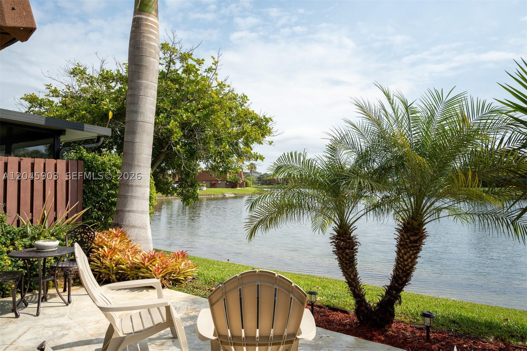 Hidden gem in Village of Lake Pines II offering spacious living areas filled with natural light and gorgeous lake views!  Features a modern kitchen with updated appliances, granite countertops, dining room and comfortable living room. Large master with en-suite, Terrazzo tile, 2 additional bedrooms, 2 1/2 baths total, office / den, laundry room, attached garage, laminate flooring. Relax outside front courtyard or back patio facing the lake. Conveniently located near local shops, dining, parks, bike/walking paths. The community has a pool, bbq, playground, basketball, tennis and pickleball and top rated schools!  Enjoy a blend of comfort and convenience in this inviting home! Newer appliances, impact windows, roof in 2019 (warranty through 2039), AC replaced in 2018.