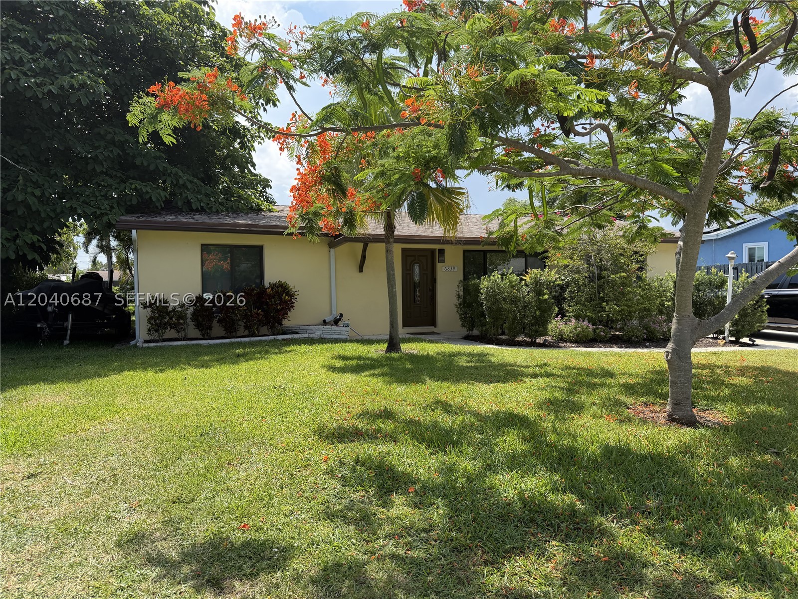 Waterfront living at its finest in the sought-after Island Estates community. This move-in ready 3BD/2BA + den home sits on a navigable waterway with direct access to Lake Osborne, Lake Clarke, and beyond — a boater's and water lover's dream. From weekend adventures on the water to peaceful mornings watching the sun rise over the canal, this property puts the best of Florida living right at your doorstep.

Skip the renovations — the big-ticket items are already done. A newer roof, impact windows, updated A/C, and upgraded electrical panel give you instant peace of mind from day one. Inside, tile floors flow seamlessly throughout the entire home, creating a clean and polished look that's easy to love and even easier to maintain. The kitchen shines with granite countertops, warm wood cabinetry, and ample storage, while the open living and dining areas frame stunning water views that make every day feel like a retreat.

Step outside to a screened patio overlooking the water — the perfect spot for morning coffee, evening dinners, or simply soaking in the Florida breeze. The generous backyard offers plenty of room to design and add your dream pool, giving you the opportunity to create your own private, resort-style oasis tailored exactly to your lifestyle.

With approximately 1,520 square feet of thoughtfully maintained living space and a versatile den ideal for a home office or guest room, this home truly has it all.
