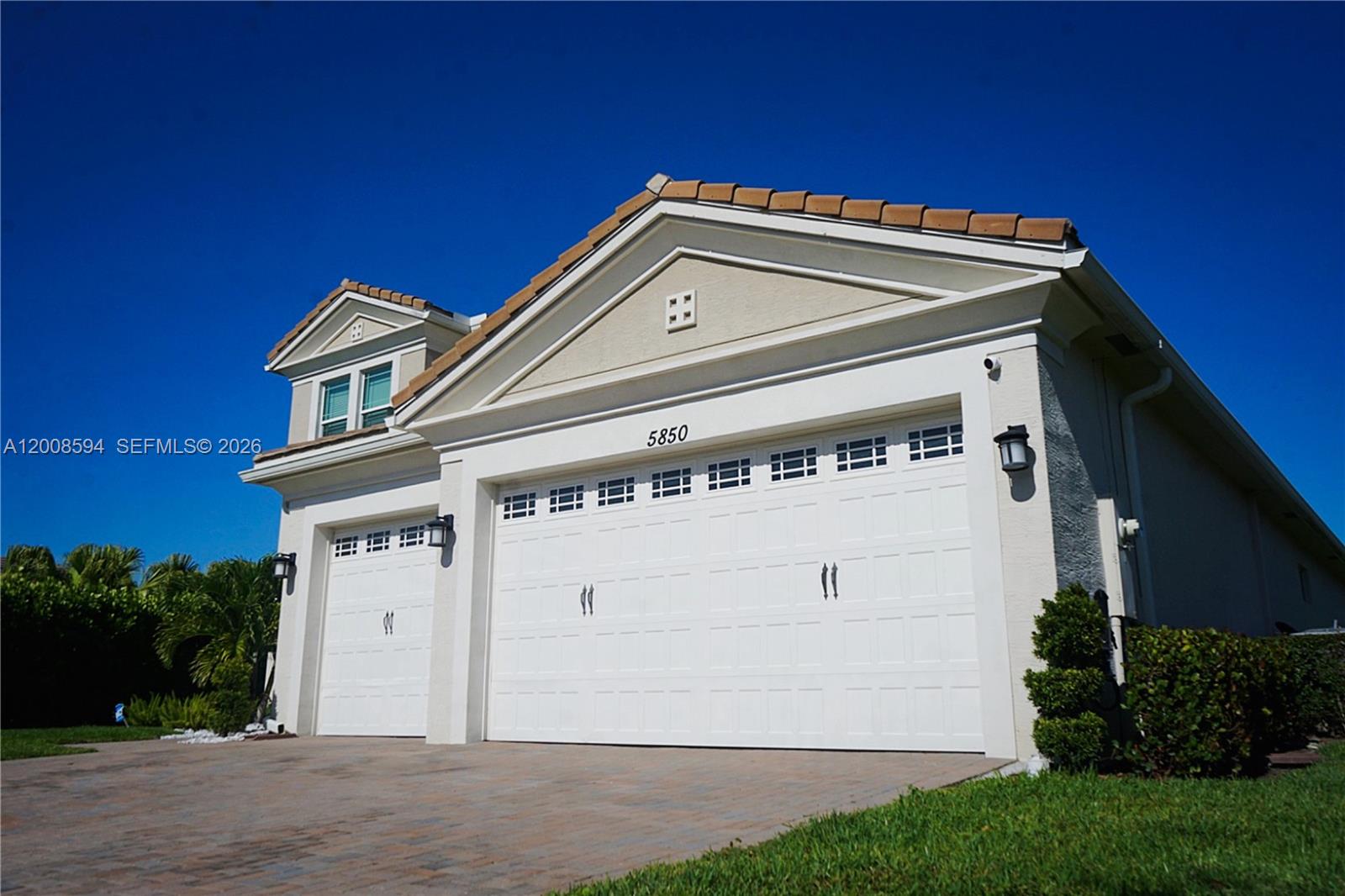 Beautifully maintained 7BR/4.5BA lakefront home with over 4,000 SF in one of Palm Beach County’s fastest-growing communities. Features include brand-new flooring on the main level, upgraded kitchen with quartz countertops, and a downstairs suite with a full added bathroom—ideal for guests or multi-generational living. Additional upgrades include custom slat wall, fresh interior paint, and enhanced landscaping. Property also includes EV charging capability. Move-in ready. Easy to show—schedule through ShowingTime.