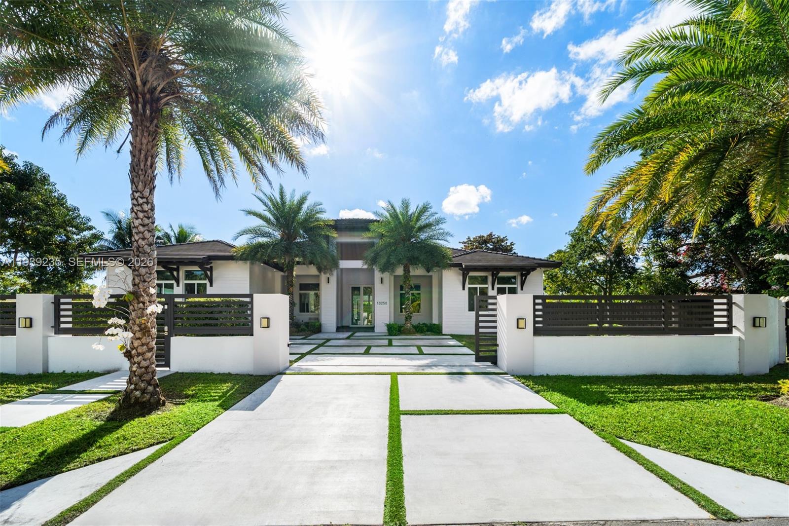 Exuding timeless sophistication, this exceptional 4-bedroom, 5-bath estate spans 3,865 square feet on an impressive 20,928 sq ft lot. Thoughtfully curated open-concept interiors are bathed in natural light, creating an elegant yet inviting atmosphere ideal for both intimate living and grand entertaining. The gourmet kitchen, centered around a striking island, seamlessly connects to expansive living and dining areas. A temperature-controlled wine cellar offers a refined indulgence for discerning collectors. Outdoors, a resort-style pool and covered terrace provide a private sanctuary for relaxation and al fresco gatherings.