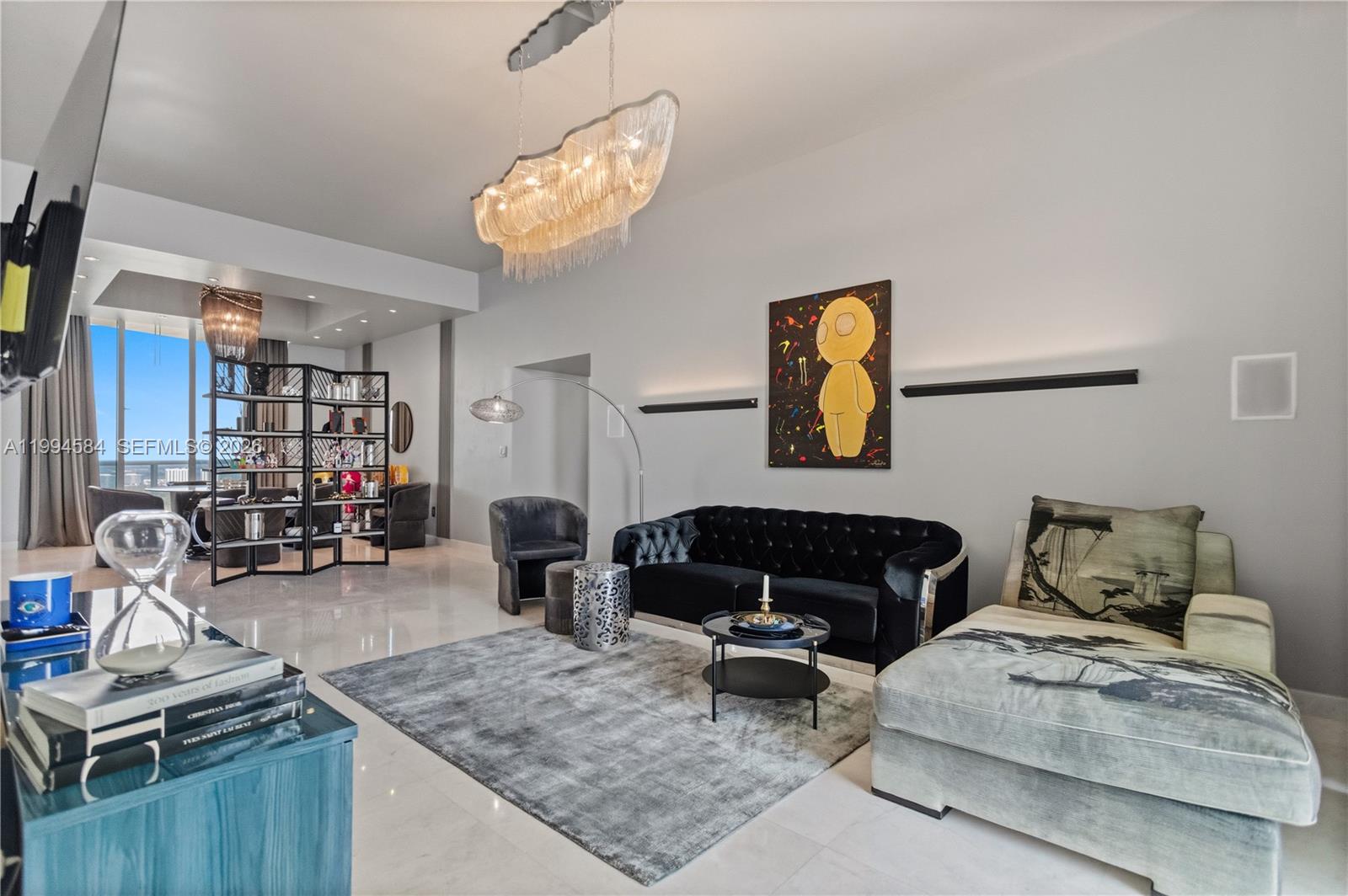 Experience refined oceanfront living from the 40th floor in this exceptional 3-bedroom, 3.5-bath residence in Sunny Isles Beach. Offering 2,558 square feet of interior space, this fully furnished, designer-finished home features 11-foot ceilings and expansive floor-to-ceiling glass, creating a seamless flow between sophisticated interiors and breathtaking views. Enjoy four private balconies with direct oceanfront exposure and unobstructed Intracoastal views — capturing both sunrise and sunset from your residence. This turnkey property is thoughtfully curated with high-end designer furnishings, including Armani chandeliers and a beautifully customized primary bedroom, delivering a truly elevated living experience. The spacious layout provides privacy, comfort, and functionality, ideal for both everyday living and entertaining. Additional features include two valet parking spaces and access to full-service luxury amenities. A rare opportunity to own a fully finished sky residence in one of Miami’s most prestigious oceanfront locations.