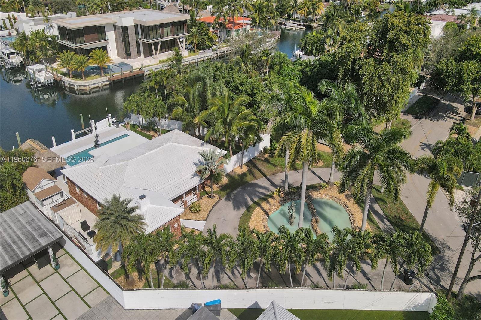 Beautiful, tropical waterfront home in the gated community of Keystone Point. This unique property is situated on a huge 13,803 SF lot & offers an open & bright floor plan, pool, 3 bdrms, and 2 baths. Be greeted by a luscious landscaped pond with fountain, making a grand impression as you pull into the property. Spacious bedrooms, renovated kitchen and open living areas with an office/den flowing into the sun room… overlooking the pool & canal. Never want to leave your private backyard featuring a large pool, tiki hut and brand new 75ft dock w/boat lift. Broad canal with no fixed bridges to the open bay! Minutes to the Haulover Inlet and ocean. Additional detached AC'ed Mancave/storage space. Separate laundry. Property is minutes to Bal-Harbor shops, beaches, 5 star restaurants, grocery stores and more!