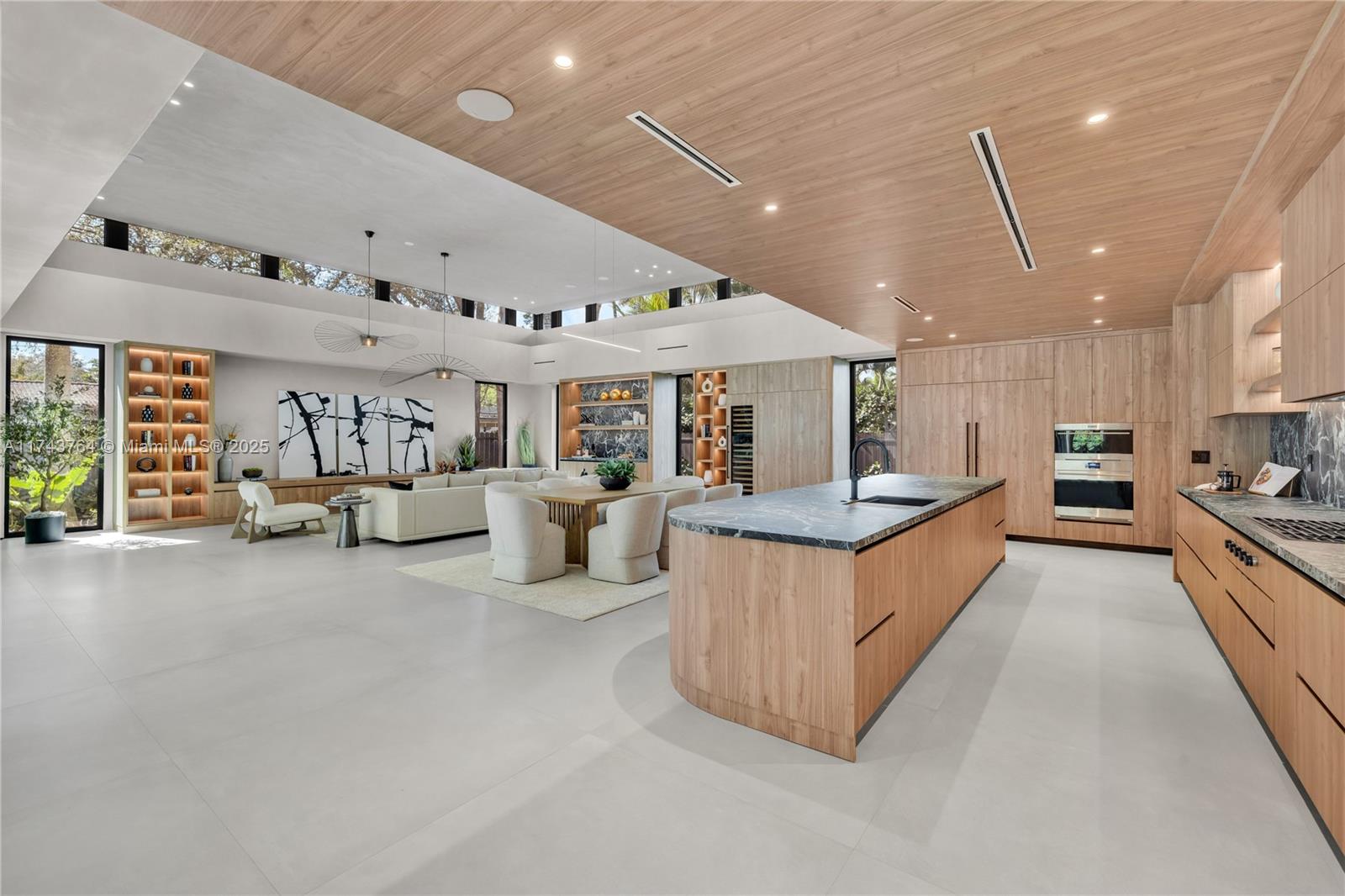 Tucked away on a lush, secluded cul-de-sac in Biscayne Park, this brand-new 2025 luxury estate is a timeless masterpiece, seamlessly blending modern design with natural beauty and the finest quality finishes. Spanning 6,680 sqft, this 6-bed, 7.5-bath residence is bathed in sunlight, effortlessly merging indoor and outdoor living. Soaring ceilings, bespoke wood millwork, and a chef’s kitchen exude sophistication, while quadruple closets, a massive walk-in, and a staff room ensure ultimate functionality. Lush landscaping envelops a private oasis with an automated saltwater pool, high-efficiency A/C, and a handicap-accessible ramp. A rare gem in Miami’s prime Upper East Side location!