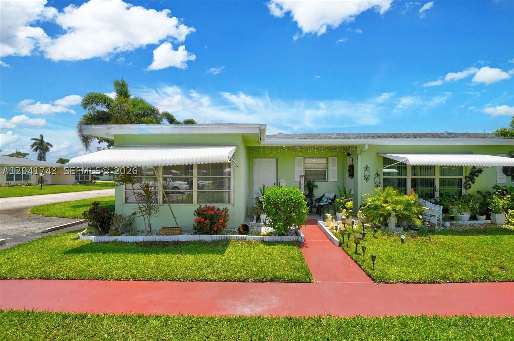 Welcome to Pine Point Villas, a desirable 55+ community in Boynton Beach. This well-kept 2-bedroom, 2-bath villa offers a bright, comfortable layout with spacious living and dining areas, plenty of natural light, and easy-care flooring throughout the main living areas. The kitchen features wood cabinetry, granite countertops, a pass-through/breakfast bar, and great functionality for everyday use. Both bedrooms offer comfortable space, with two full bathrooms for added convenience. Enjoy relaxing outdoor areas, well-maintained grounds, and the peaceful villa-style setting. Pine Point Villas offers community amenities including a clubhouse, pool, shuffleboard, library/social areas, and beautifully maintained common areas. Conveniently located near shopping, dining, beaches, major roads, and everything Boynton Beach has to offer. A great opportunity to own in an active 55+ community in a prime location!
