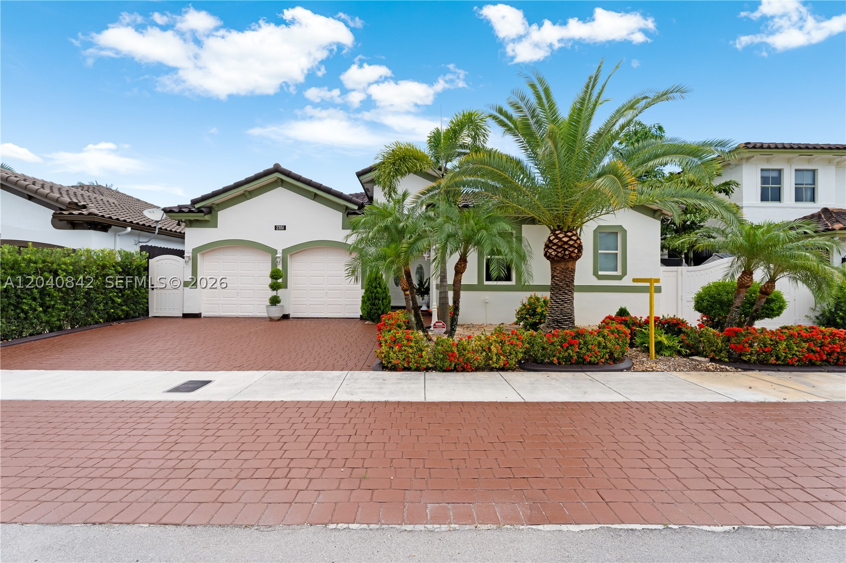 Situated on a generous 6,744 s/f lot in a quiet, family-oriented neighborhood with NO HOA! Offering 2,686 total s/f, this meticulously maintained residence features 3 bedrooms, 2.5 bathrooms, and a spacious 2-car garage. Open floor plan, high ceilings, elegant crown molding, beautiful crystal chandeliers throughout, and stunning 24" x 24" porcelain flooring installed throughout. Additional upgrades include impact-resistant windows and doors, central vacuum system, double insulation in the roof and walls for enhanced comfort and energy efficiency, insulated garage door, sprinkler system, California closets, and thirteen security cameras installed around the property. Exterior windows, metal gates, and garage doors have been professionally finished with durable electrostatic paint. The remodeled kitchen features custom wood cabinetry, granite countertops and backsplash, brand-new stainless-steel appliances, and ample storage and workspace. The oversized primary suite measures approximately 24' x 19' and serves as a private retreat, complete with a wall-mounted air-conditioning unit, 2 spacious closets measuring approximately 7' x 5' each, and a luxurious classic-style bathroom featuring a Jacuzzi tub, oversized shower, separate toilet, and bidet. Enjoy the beautifully landscaped backyard, a brand-new fence, a custom-built 16' x 13' pergola constructed with sturdy 6" x 6" posts and interior lighting. Side entrance big enough for a boat/car.