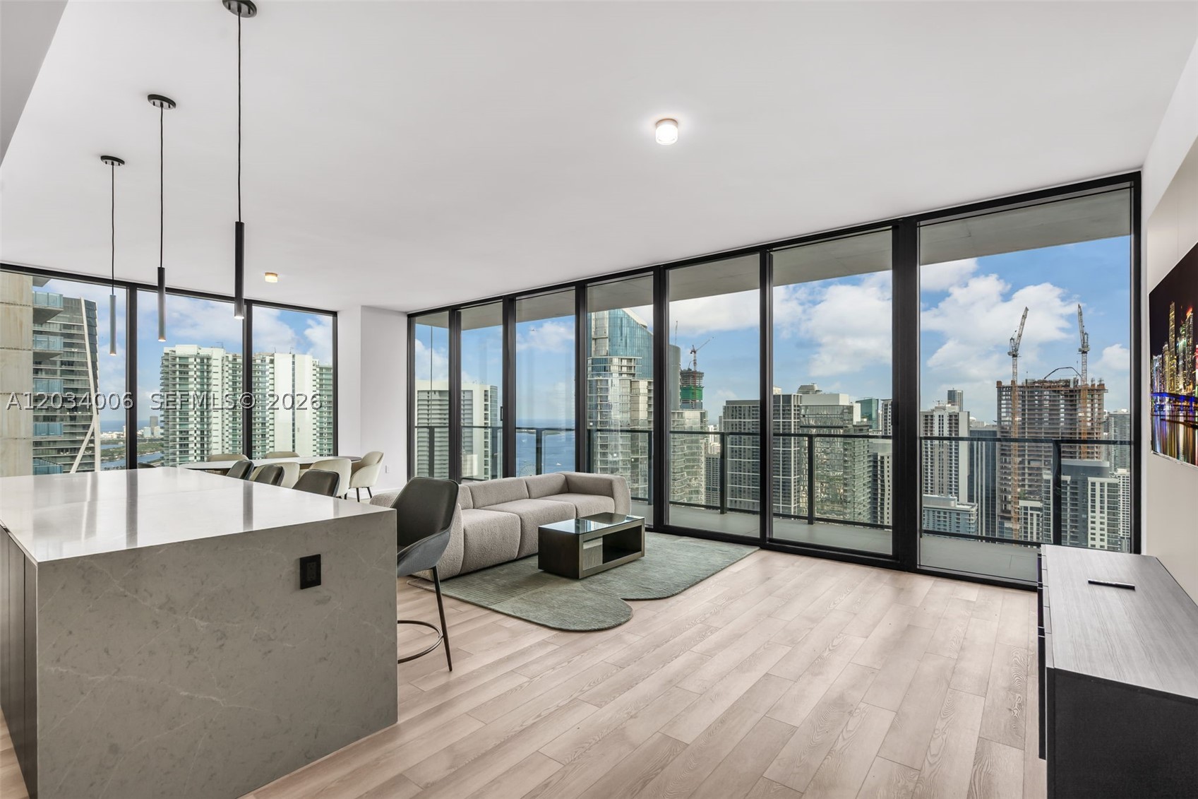 Experience luxury resort-style living in this furnished corner residence offering nearly 2,500 SF of interior space and breathtaking views. This spacious home features floor-to-ceiling glass, expansive living and dining areas, and an abundance of natural light throughout. Residents enjoy exclusive access to private daytime pool events, a state-of-the-art fitness center, and membership to the private beach club. A spectacular 10,000 SF spa is coming soon, further elevating the unmatched amenity package. Whether as a primary residence, vacation home, or investment, this is an opportunity to own in one of the area's most exciting luxury communities. Take advantage of current pricing before future increases. Contact listing agent for details.
