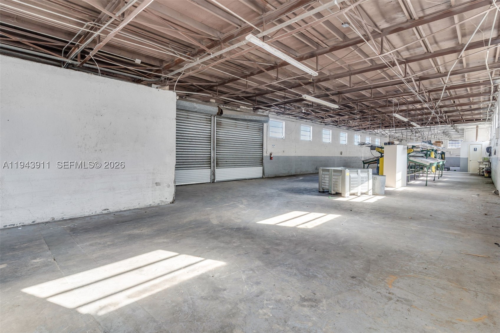 FOR SALE...MULTI USE..13,000 SQ.FT. CBS BLDG WITH OFFICES N BATH, 2/1 HOUSE CURRENTY OCCUPIED MONTH TO MONTH ,PAD W SEPTIC, MANGO GROVE.. IDEAL FOR STORAGE /PARTIES OR CONTINUE AS A PACKING HOUSE/ 8 ACRES OF TOMMY ATKINS MANGOS ON 9 +ACRES..A FEATURES.SEPERATE ENTRY INTO HOME AND ANOTHER INTO COMMERCIAL AREA...LOADING DOCK IS DECK HEIGHT. EXECUTIVE OFFICES, BATHS, 2 HUGE CBS BUILDINGS WITH 2 COOLERS. (3 ON SITE) IRRIGATION, BOXES..YOU CAN DRIVE EQUIPMENT/ CARS INSIDE. THEY ARE OLDER SOLID CBS CONSTRUCTION ...IMPRESSIVE.EACH BLDG IS OVER 6500 EACH. BOTH HAVE A COOLER. FENCED AND GATED. SO MANY OPTIONS IN ADDITION TO AND OTHER THAN PACKING HOUSE. CALL FOR VIEWING AN EASY SHOW...IF DESIRED SELLER WILL RENT