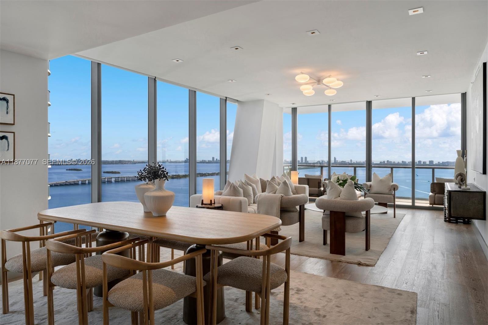 Set within Edgewater’s premier boutique development of only 94 residences, Residence #3202 offers 4 bedrooms + Den, 5.5 baths, and an NE corner position with panoramic views of Miami Beach, Edgewater, and Wynwood. Highlights include 10-ft floor-to-ceiling windows, gourmet kitchen with Wolf gas range and Sub-Zero appliances, custom finishes & lighting, white oak flooring, automated shades, private elevator foyer, and storage unit. Designed by Jean-Louis Deniot, residents enjoy curated amenities: 2 resort-style pools, state-of-the-art fitness center, spa, and 5-star concierge services.