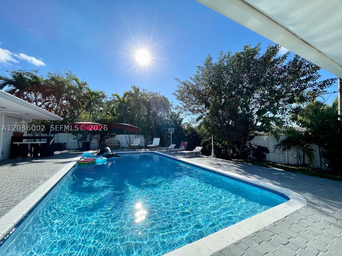 Introducing this wonderful single-family home, meticulously finished with an open living space area. Private and lovely outdoor space for entertaining and relaxing. Hurricane Impact Windows / Doors. 2017 Roof, New PVC Plumbing, Converted Garage, All Work Permitted and code compliant. Beautiful Views from every room; sunsets over the pool and sunrise from the front porch! Peaceful and Private. Featuring 4 bedrooms plus Office/Den and 3 bathrooms. 6 cars fit in the driveway. This beautiful property is 5 miles to Hollywood beach, 1.5 mile to 95, 1.5 miles to Train Station, .7 mile to Publix 2.3 miles to Turnpike. The sensation and lifestyle that you will experience at this single-family house is indescribable, you have to live it! Yes, you just found the luxury lifestyle you were looking for at Hollywood.