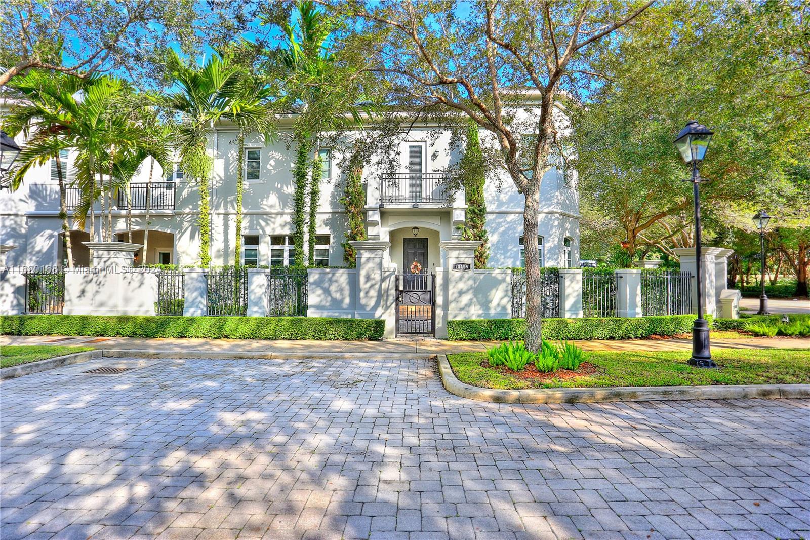 Welcome home to this North Pinecrest paradise! Offering all the comforts of a single family home yet conveniences of a large Villa! Gracious, step up entrance opens to large living room on the left & dining room on right, connected by Butler's pantry to bright, open kitchen. Tumbled travertine floors throughout main level. Huge family room off kitchen opens on to a private pool, covered terrace & tranquil walled backyard. Luxurious master suite w/ office, spacious walk-in closets and high end finishes throughout. Abundant natural light graces this home through all impact doors & windows. Elevator, spacious laundry room, 2-car garage, whole house natural gas generator & much more help complete this fab residence! Corner lot on quiet cul-de-sac. Superb school district.