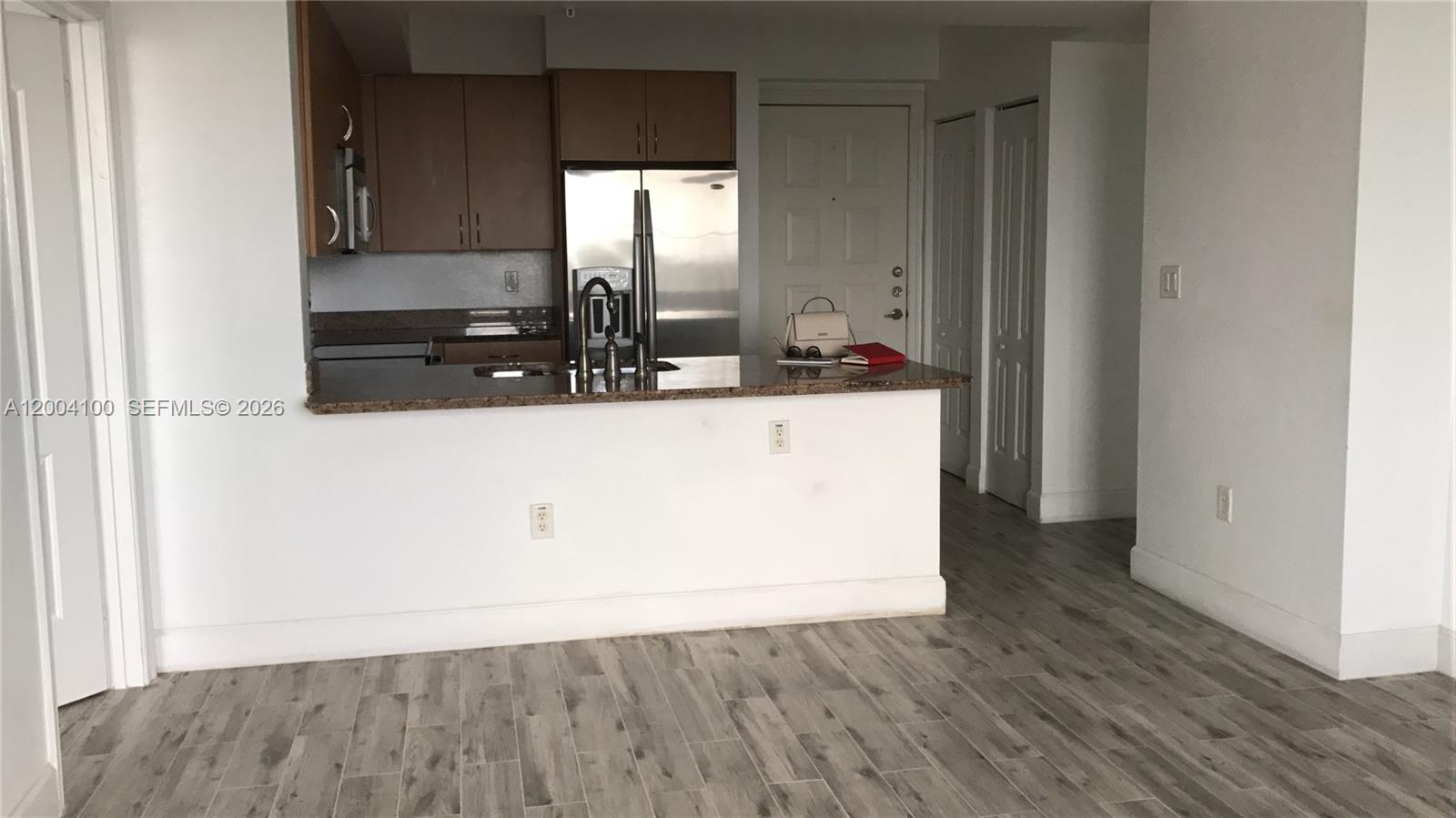 Welcome to Radius Condominium, a modern 2-bedroom, 2-bath residence in the heart of downtown Hollywood. This well-designed unit features a split floor plan, offering privacy and flexibility for roommates, families, or a home office setup. The open living and dining area is filled with natural light and connects seamlessly to a contemporary kitchen with ample cabinetry and a convenient breakfast bar. The primary suite includes a walk-in closet and a private bathroom, while the second bedroom is spacious and versatile. Enjoy the convenience of in-unit laundry, generous storage, and a private balcony—perfect for relaxing after a long day. Radius offers resort-style amenities, including a rooftop pool, state-of-the-art fitness center, clubroom, business center, and 24-hour security. Ideally located just minutes from Hollywood Beach, restaurants, shopping, and major highways, this condo provides both comfort and convenience