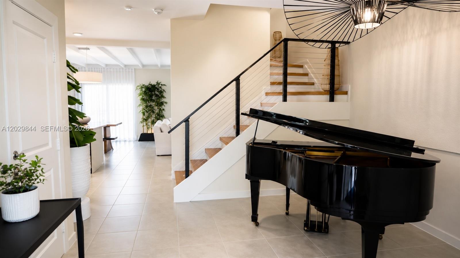 Now for sale ? Professionally designed and featured on HGTV, this completely upgraded modern residence offers over $50,000 in renovations and elevated designer finishes throughout. Featuring soaring ceilings, unobstructed views with a beautiful partial lake view, luxury curtains, and designer lighting throughout the home.

The chef’s kitchen showcases handcrafted zellige tile, modern matte black faucets, custom design beams, and curated finishes that create a warm contemporary aesthetic. Additional upgrades include hardwood stair steps, new black stair railings, handwoven details, upgraded half bathroom wall treatments, and large commercial-grade luxury vinyl flooring upstairs.

The primary suite was transformed into a spa-inspired retreat with Moroccan lighting and tile, a European panel feature wall, rain shower, and custom wall treatments. One bedroom has been converted into an oversized custom closet but can easily be converted back into a fourth bedroom if desired.

The backyard was fully redesigned for entertaining with custom lighting, oversized marble pavers, turf, and a built-in custom brick BBQ and pizza oven.

A rare turnkey designer home with thoughtfully curated upgrades throughout - 15 minutes from Aventura. Easy to show — DM for details and private showings.
