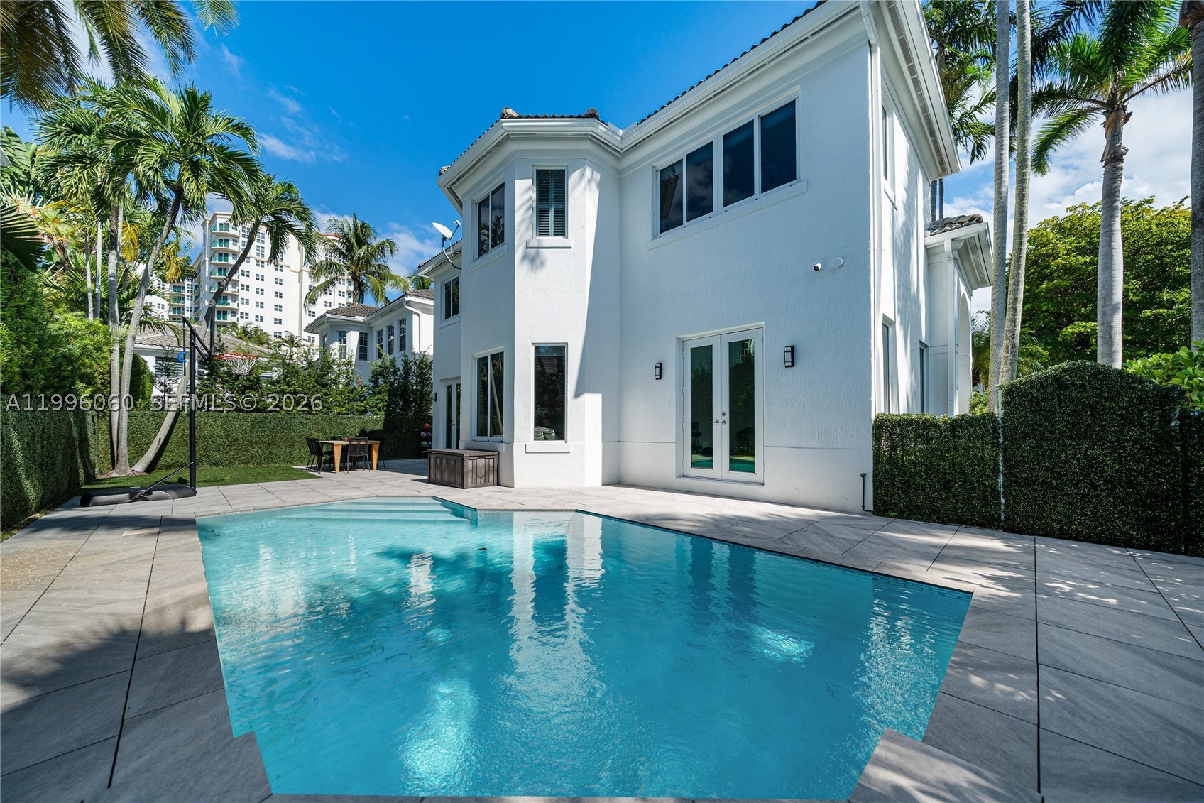 Two-story pool home with a 2-car garage in the gated community of Country Club Estates, Aventura. Situated along the Turnberry golf course and steps from the Aventura Circle path, this 3-bedroom, 3-bathroom residence offers 3,480 square feet of well-designed living space with 22-foot ceilings and abundant natural light.
The open living and dining areas extend to a private patio and pool, creating a seamless indoor-outdoor setup well suited for entertaining or everyday use. Upstairs, the primary suite includes two walk-in closets and a spacious spa-style bath with shower. Additional features include a separate laundry room and a flexible garage that works for storage, a home gym, or a second vehicle.
Zoned for ACES and Don Soffer High School. HOA covers security, landscaping, and pool service. Walking distance to the 3-mile Aventura Circle path. Minutes from Aventura Mall, Turnberry Isle Resort, parks, cafes, and houses of worship.
If you are searching for a gated pool home with a garage in Aventura, this is one of very few available in Country Club Estates.