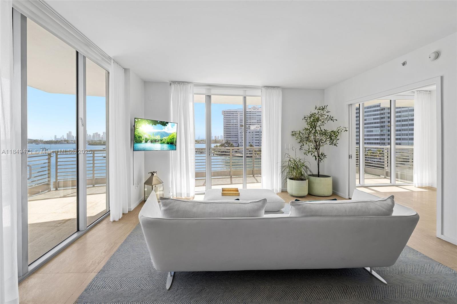 Luxury Meets Serenity in this 2 Bed + Den/Bedroom & 3 bath residence at Capri South Beach. Discover the epitome of Miami Beach living in this exceptional boutique bayfront building that offers a harmonious blend of luxury, comfort, & tranquility. If you're seeking a place where luxury & serenity coexist, where bayfront living meets urban convenience, this is your opportunity. Step inside this spacious & thoughtfully designed residence to find a world of elegance & sophistication. The open-concept living area is bathed in natural light, thanks to expansive windows that frame breathtaking views of Biscayne Bay & the Miami skyline, creating an inviting ambiance that's both stylish & welcoming, just steps from Lincoln Road plus a bayfront pool, spa, gym, & 24-hour concierge service.