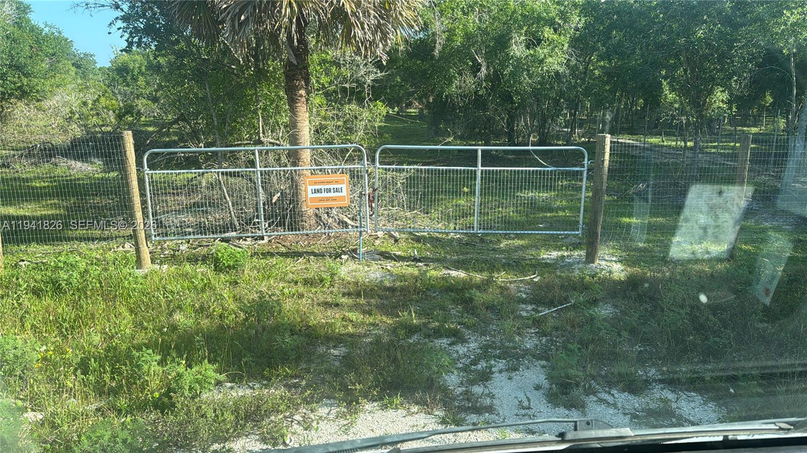 Great opportunity to own 1.25 acres in Okeechobee. Property is fully fenced and features an 18’ x 30’ culvert for easy access. Power available at the road, flat and usable terrain, and NO HOA. Ideal for future construction, mobile home, or recreational use. Buyer to verify zoning and permitted uses.