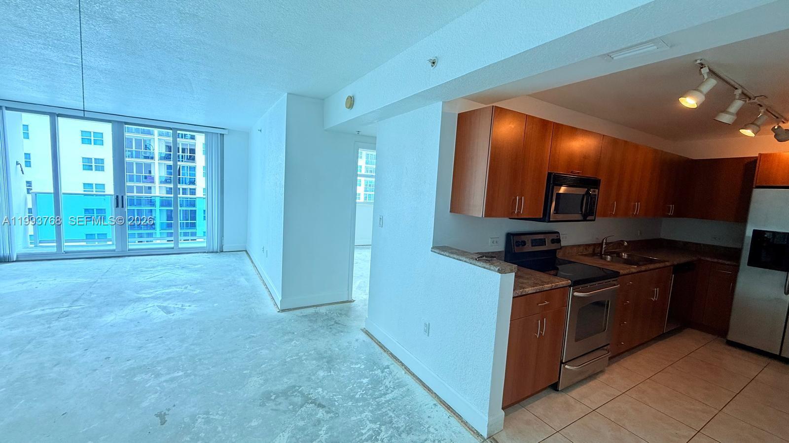 Welcome to Treasures on the Bay! This spacious 8th-floor residence features sun-drenched, south-facing interiors and serene partial bay views. Ideally located in the heart of North Bay Village, you are just minutes from both the beach and the mainland. Unit is been improved. Ask for details. Enjoy peace of mind as the owner will pay all Special Assessments at closing, covering recent upgrades like new elevators and completed building work. Includes one parking space. Experience bay front living in an area poised for exciting transformation. Vacant and easy to show—schedule your tour today!