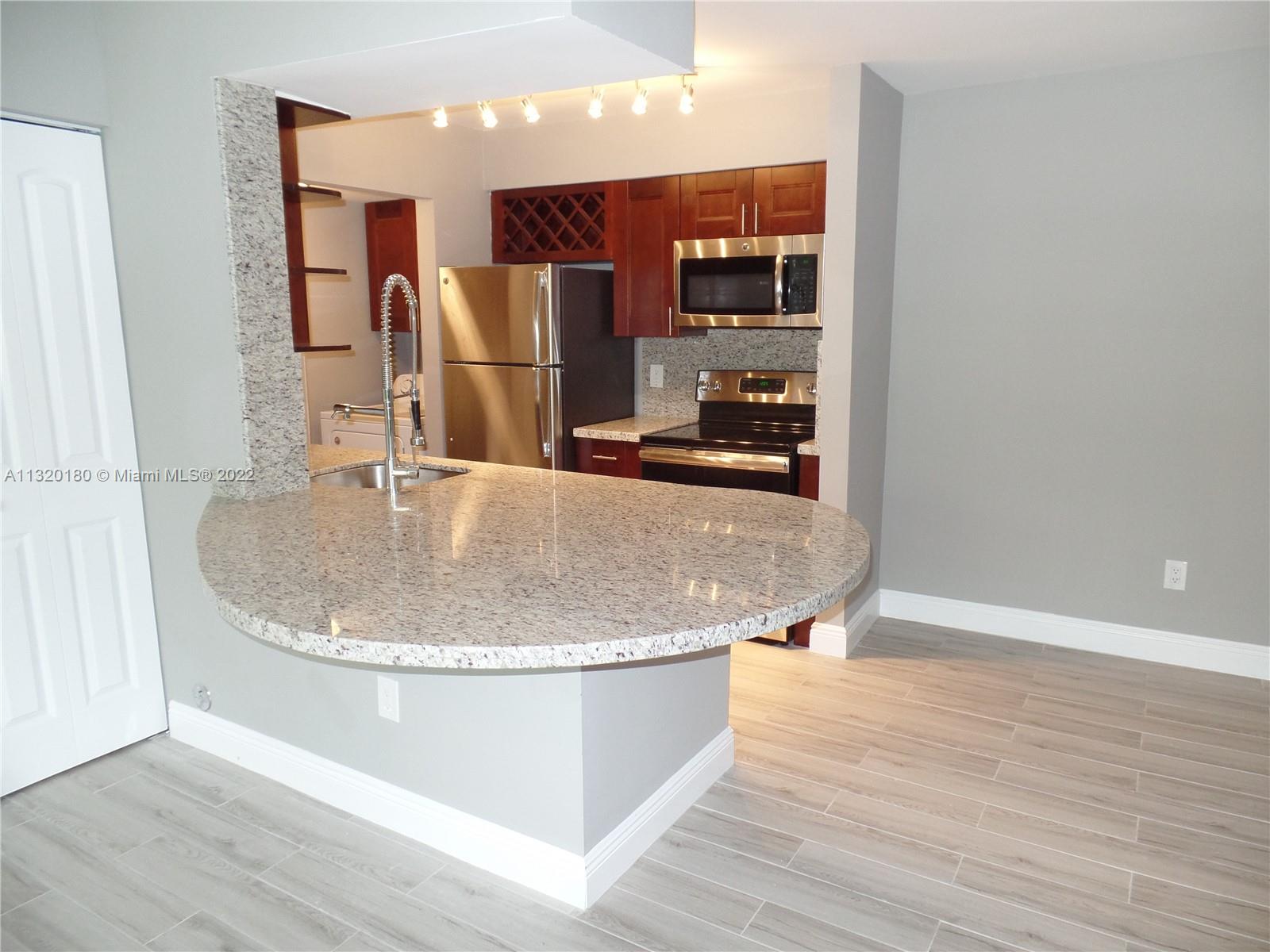 Totally Upgraded 2 bedroom 1 bathroom condo in the Royal Poinciana gated community. Porcelain tile floors throughout, granite countertops and stainless appliances. Full size WASHER and DRYER inside. Pets OK. Resort style amenities. Landlord is flexible with move-in deposits for tenants with good credit.
