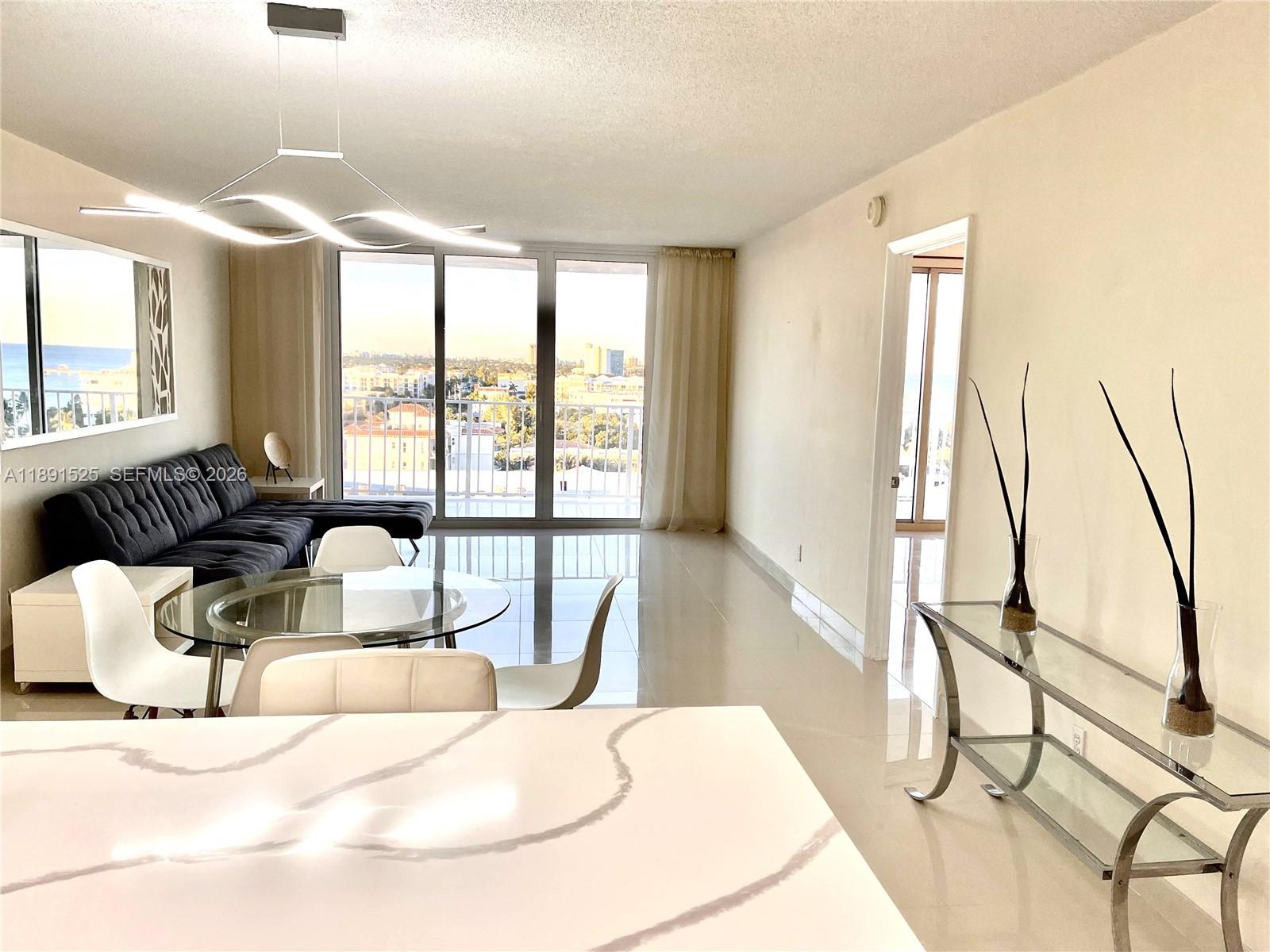 Beautiful top-floor oceanfront 1BR/1.5BA condo — fully remodeled and move-in ready! Enjoy morning coffee with ocean breezes and breathtaking water views from your private balcony. Walk or bike to the famous Deerfield Beach International Fishing Pier, relax on the private beach, swim in the heated pool, or unwind at the beachfront Tiki Hut while watching the sunset.

Bright open living and dining areas are filled with natural light through new impact windows and sliding glass doors. Convenient parking includes an oversized resident space plus guest parking.

The brand-new kitchen includes a dishwasher, microwave, oven, and full-size refrigerator with icemaker. Both bathrooms have been updated with modern finishes. Laundry facilities and bicycle storage are available in the building.

Required inspections and maintenance updates have been completed. Seller is unaware of pending special assessments. Amenities include a heated pool, fitness center, social/game rooms, sunset lounge, private beach access, oceanfront BBQ area, and Tiki Hut. Low HOA fees and efficient management make this an excellent option for seasonal or year-round living.

Ideally located a short walk from restaurants, shopping, and the beach pier. Private showings available in person or virtually.