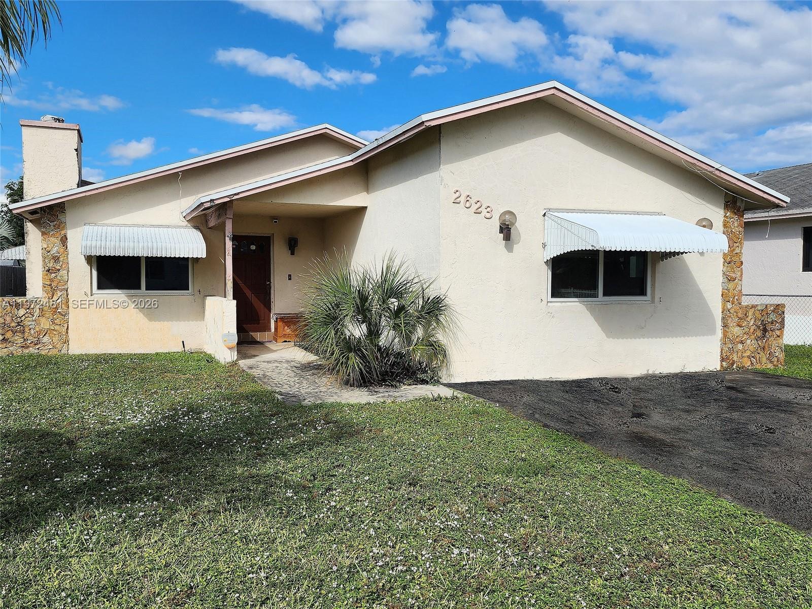 Beautiful Home in Desirable East Hollywood - No HOA! This true 4-bed 2-bath residence features high-efficiency A/C, hurricane-impact windows, & ample space to add a pool. Located in a non-flood zone, just 10 minutes from the beach and close to the Hard Rock and Dania Pointe entertainment districts. The 4th bedroom has its own private entrance and can easily be converted into a large studio apartment; plumbing is already in place for an additional bathroom.