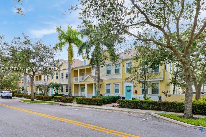 Welcome home to 118 Seagrape Dr 105! This beautiful two-story, 3-bedrooms, 2.5-bathrooms, plus 1-car garage townhome is nestled in the serene and convenient community of Sandpiper Cove at Botanica! Upon entering, notice the open living space with gorgeous 30x30 porcelain tile flooring complemented by new oversized baseboards and neutral paint colors. New crown molding gracefully frames the first floor, adding a touch of sophistication to the living areas. Adjoined to the living-dining space is a newly updated powder room. Step into the quaint kitchen featuring granite countertops and stainless steel appliances, creating a perfect blend of functionality and style. A delightful breakfast area, perfect for a kitchen dinette, overlooks the tranquil courtyard patio, offering an inviting  private space for morning coffee or intimate meals and gatherings. The second-story master suite offers a spacious bedroom with crown molding, a large walk-in closet with built-in shelving, and a second closet. The ensuite bathroom boasts dual sinks, a large soaking tub, and a separate walk-in shower. The second floor unfolds with a split floor plan, featuring a loft space adorned with   wood-look plank flooring, two additional bedrooms, and an updated second bathroom with new toilet and tub. Recent enhancements include new carpeting in the bedrooms and crown molding throughought. Practical updates enhance the functionality of this home, including a new full-size washer and dryer (2023).
