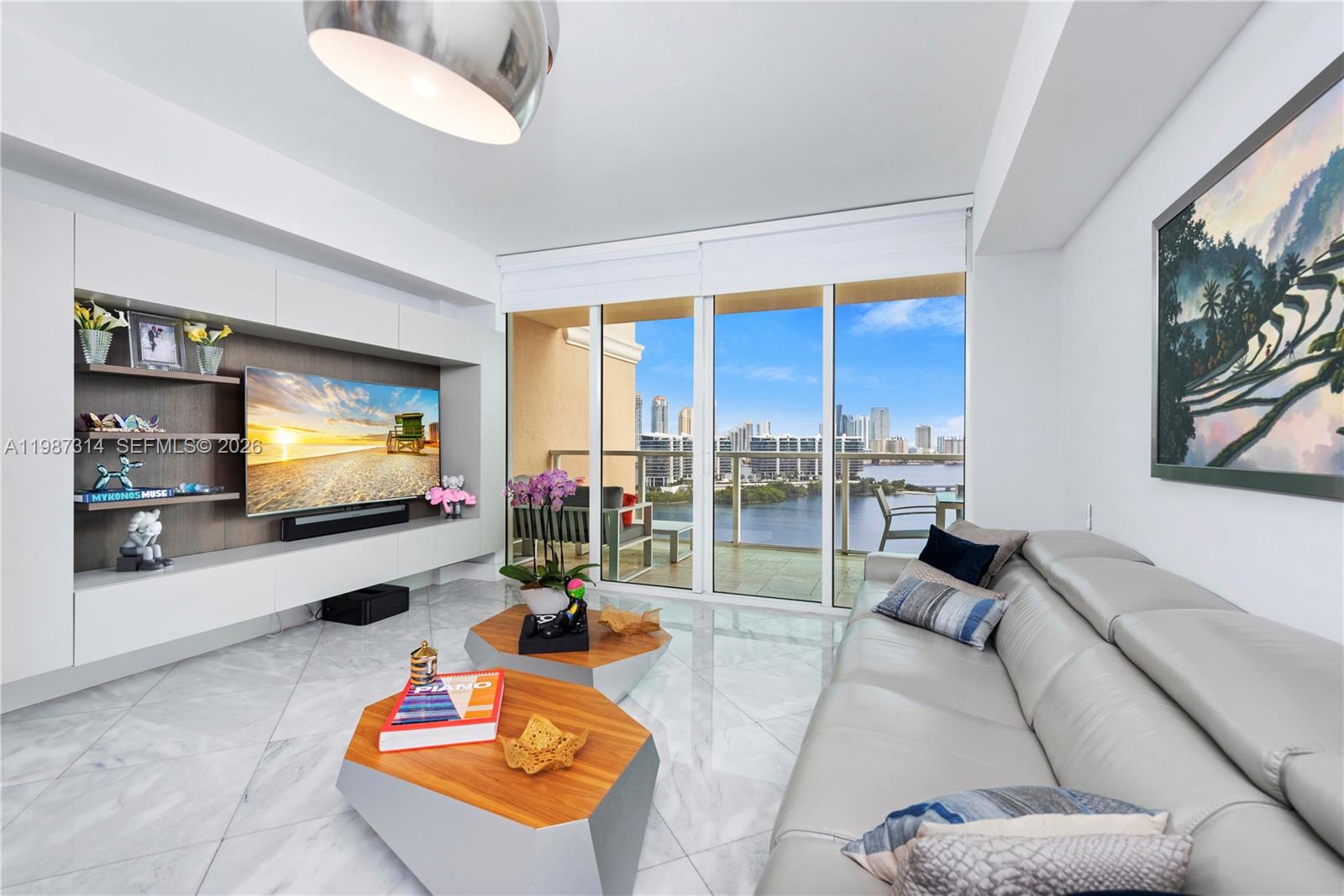 This stunning 3-bedroom, 3-bath residence at Aventura Marina II is situated on the most desirable line in the building, offering ultimate privacy with a private elevator and exclusive foyer entry. Boasting 1,849 sq ft, the unit features breathtaking open water views of both the Atlantic Ocean, the Intracoastal, and the Sunny Isles skyline.
Fully upgraded from top to bottom, the residence showcases white marble and Italian porcelain flooring, electric blinds, and custom Italian closets and fixtures, including new kitchen cabinets and appliances. Every detail has been thoughtfully curated to create a refined, private oasis with a seamless blend of luxury and comfort.
Residents enjoy resort-style amenities including a two-story fitness center and spa, Yacht Club, and private marina. Ideally located in the heart of Aventura, the building sits next to the city’s premier public park—Founders Park—offering exceptional amenities for children and families, and is within walking distance to the renowned Aventura Mall.