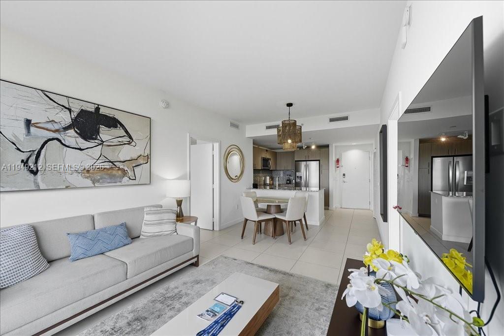 Live in the exclusive area of Downtown Doral & enjoy this luxury apartment. This unit has 2 Bedrooms & 2 Bathrooms, it is fully furnished, and has an independent entrance to each room. Unique floor-to-ceiling windows, very bright unit. Porcelain tile floor all over the condo. Open Kitchen concept, granite countertops, High-end SS Appliances & Cooktop. This unit has 1 assigned covered parking space. The building offers Fitness Center, Spa, Sauna, Spinning bikes, Resort pool area, Business Center, Kids room, Events ballroom, and 24/7 Valet & concierge. Just a few steps away from restaurants, supermarkets, attractions & stores. Enjoy walking your children to A+ Elementary, Middle, and High School.