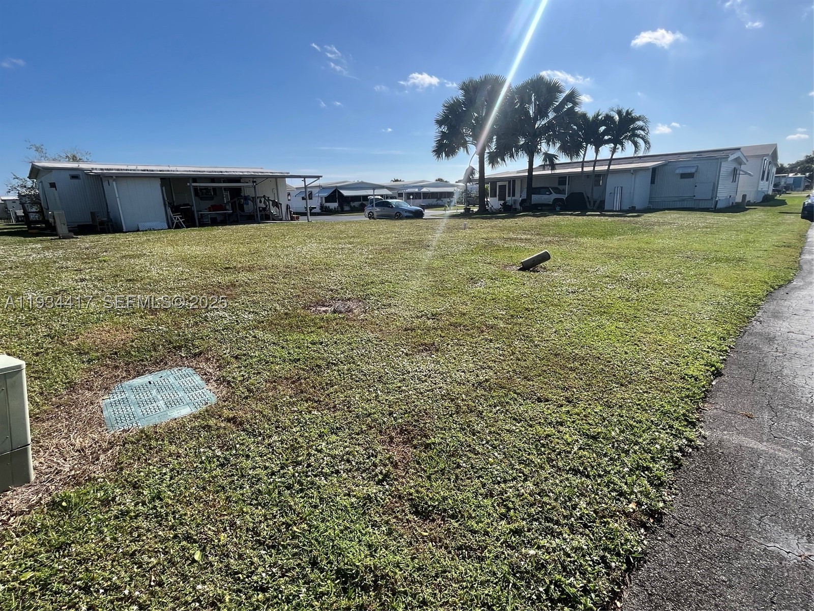 Whether you’re dreaming of a seasonal escape or a full-time residence, this vacant lot offers the perfect opportunity to enjoy affordable, carefree Florida living in one of Boynton Beach’s most desirable 55+ communities. Larger corner lot; Approximately 6 miles from the beach.
Monthly HOA dues are $270 and include internet, lawn care, water, sewer, trash removal, 24/7 manned gate security, on-site property management, and maintenance staff.
Community amenities include two swimming pools (one heated seasonally), clubhouse, billiards, shuffleboard, horseshoes, library, putting green, dog walk area, and additional storage for RV or motorcycle parking. This lot is intended for placement of a manufactured/mobile home only.