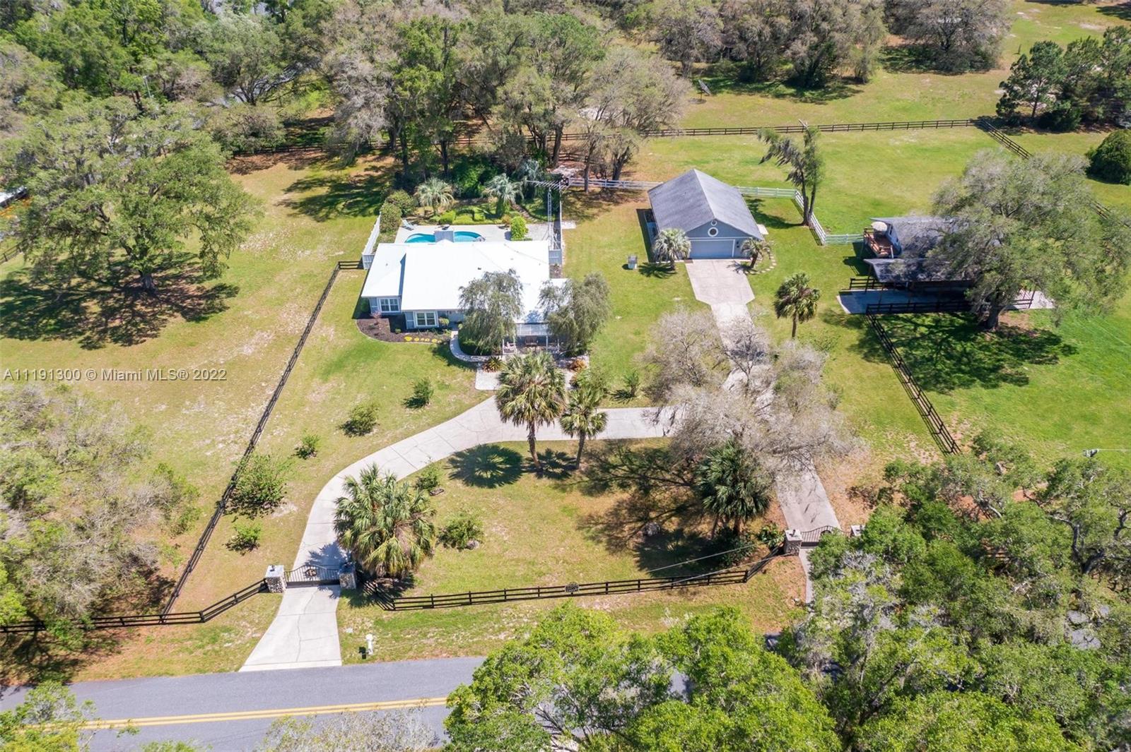 BACK ON THE MARKET AFTER BEING COMPLETELY RENOVATED - Welcome to Crystal Sky Farm conveniently located in Ocala, FL, 15mn away from the World Equestrian Center and the HITS. This 3 acres property with Pool, Spa, and Barn, sits on a quiet corner lot and has 3 separate living areas that are perfect for extra income. The main house has 2,729 sq ft w/ 3 bedrooms, 2 baths, office, large living with fireplace, family room and Florida room leading to the private pool area. The property includes also a separate detached 2 XL CAR GARAGE with a 1/1 bungalow / In-laws, and a barn boasting 5 stalls and additional space for an optional 6th stall. The barn includes an upstairs 1 Br Loft with kitchenette and deck. A1 zoned property welcomes your horses and RVs. READY TO MOVE IN.