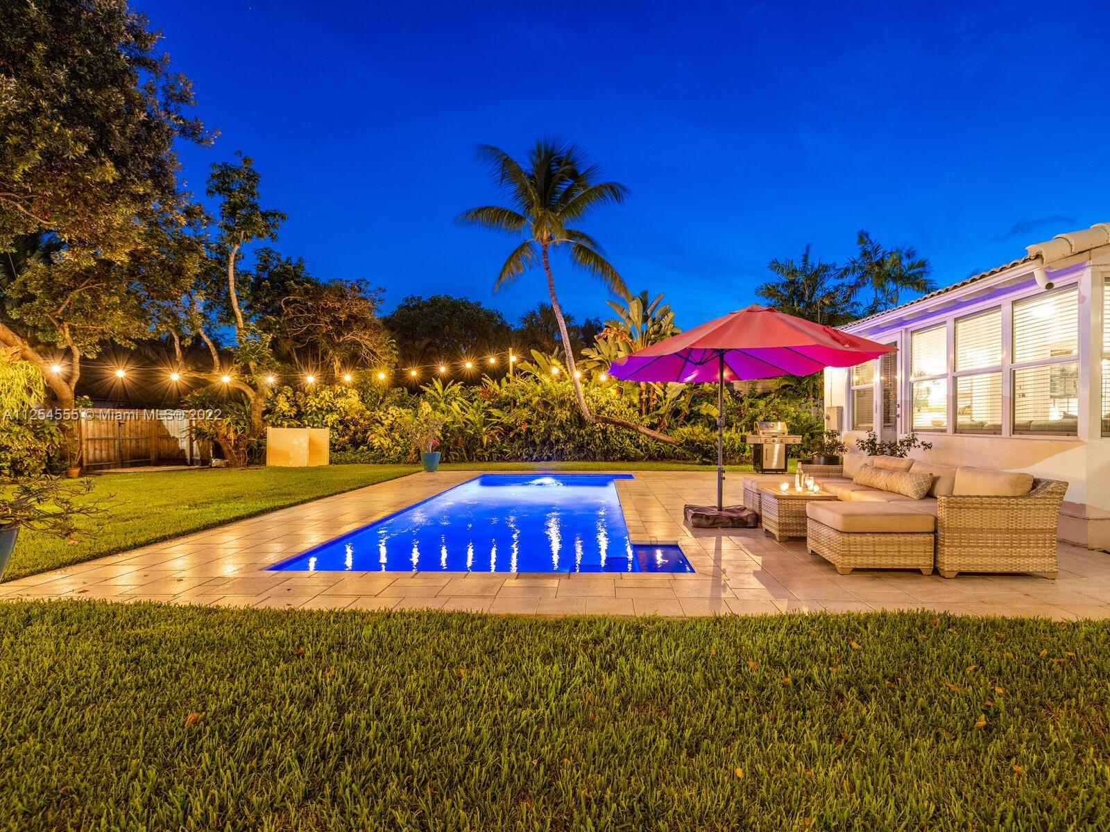 Welcome to Villa Blanca Miami Shores! Enjoy great indoor-outdoor living in this just-updated home and resort-style pool oasis on a private cul-de-sac! Delightful living with hip, large brick working fireplace that flows to dining and beautiful new kitchen, ready for you to whip up favorite recipes. Bright sunroom-media room with cool hexagon tile overlooks lush tropical rear gardens with sparkling saltwater pool and large entertainment deck. So fab, you’ll think you’re on vacation! Fire up the grill, invite friends and family and start the fun. Sweet dreams in split bedrooms—one new bedroom and new bath separate from two others and updated bath. Gorgeous wood floors, impact windows-doors, new appliances. Close to the excitement of downtown Miami Shores with great restaurants and shops.