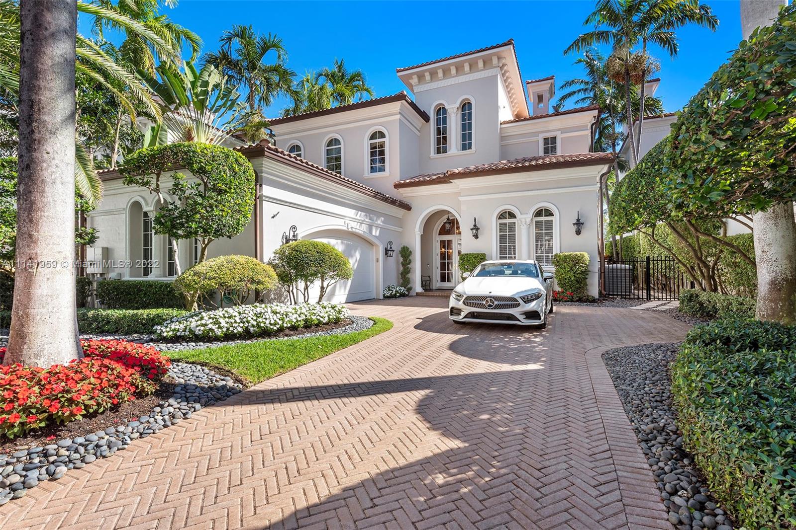 First time on the market, this beautiful waterfront home in Island Estates is in the best location with incredible views of the open bay and Sunny Isles Skyline. Over 5426 SF of living space with high ceilings, formal dining and living rooms with open kitchen to large family room and gorgeous outdoor entertaining area featuring extended deck, pool and jacuzzi and summer kitchen and fireplace. Residence has beautiful designer details throughout, marble floors and massive master bedrooms closets, with en-suite bedrooms on the second floor.  Home has a two car garage, interior elevator and a boat slip in the private Prive marina.