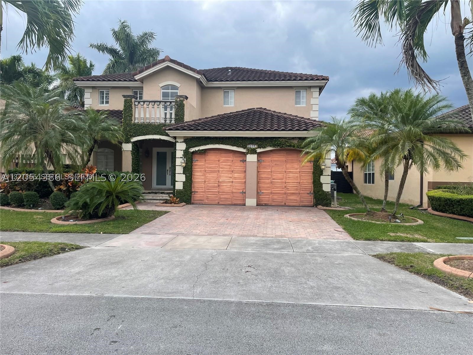 An Impressive & Beautiful Mediterranean style pool home in a great location!! Two story with high ceilings and French doors which allow light to pour in. The interiors have real hardwood floors and ceramic tile, stainless steel appliances with granite counter tops. 1 full bath on 1st floor with access to the pool, 3 bedrooms, 3 baths + a very spacious loft, double car garage, covered terrace in a very good size patio. Across from the lake, close to schools, restaurants, pharmacies & more. Since the moment you get in, you can see how spectacular it is!! Come see it for yourself.