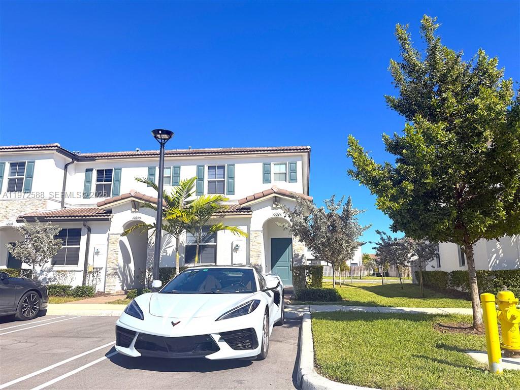 BEAUTIFUL TOWNHOME FEATURING 2 STORY, 3 BEDROOM 3 FULL BATHS LOCATED IN THE SECURED & GATED WESTVIEW COMMUNITY. THIS BANDOL DESIGN FROM LENNAR OFFERING CONTEMPORARY DESIGN WITH HIGH-END FINISHES THROUGHOUT & OPEN CONCEPT LIVING SPACE. PREFERRED CORNER UNIT FEATURES QUARTZ COUNTERTOPS, STAINLESS STEEL APPLIANCES, A LARGE ISLAND, WOOD KITCHEN CABINETS, IMPACT WINDOWS & DOORS ALL WITH ZEBRA BLINDS. THE OPEN-CONCEPT LAYOUT FLOWS INTO A PRIVATE BACKYARD WITH AN UPGRADED PAVED PATIO DECK, IDEAL FOR RELAXING & ENTERTAINING. THE SPACIOUS OWNERS SUITE INCLUDES DOUBLE SINKS & MODERN WALK-IN SHOWER. STYLISH PORCELAIN TILE FINISHES FOR ALL BATHROOMS. ENJOY THE UPSTAIRS LAUNDRY WITH INCLUDED WASHER & DRYER. RESIDENTS ENJOY ACCESS TO A COMMUNITY POOL & 2 ASSIGNED PARKING SPACES. VA ASSUMABLE LOAN
